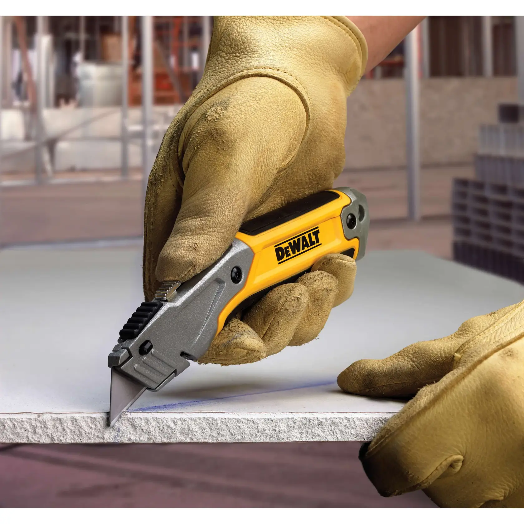 Retractable utility knife cutting hard material.