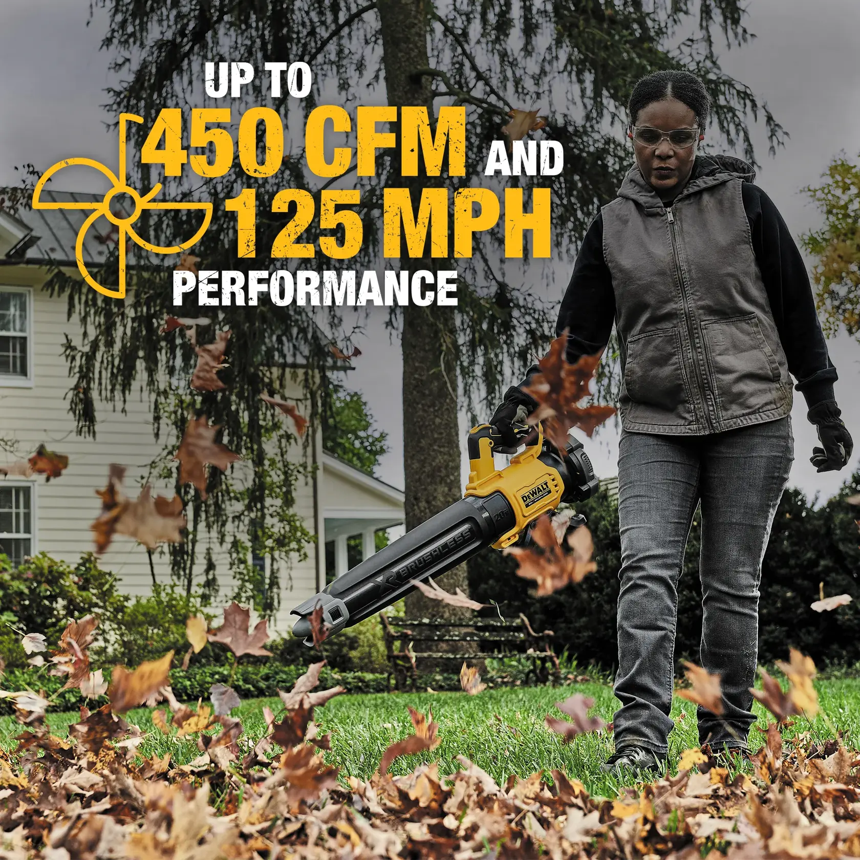 XR® Brushless, handheld blower being used to blow off grass blades outdoors. 