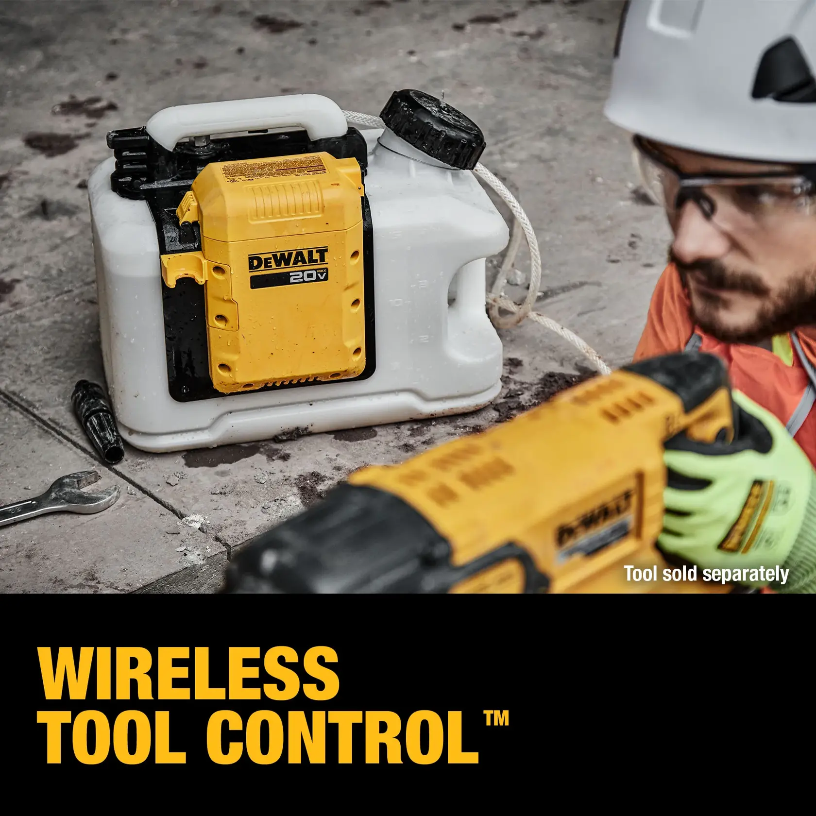 Water Tank on ground guy holding the sprayer gun