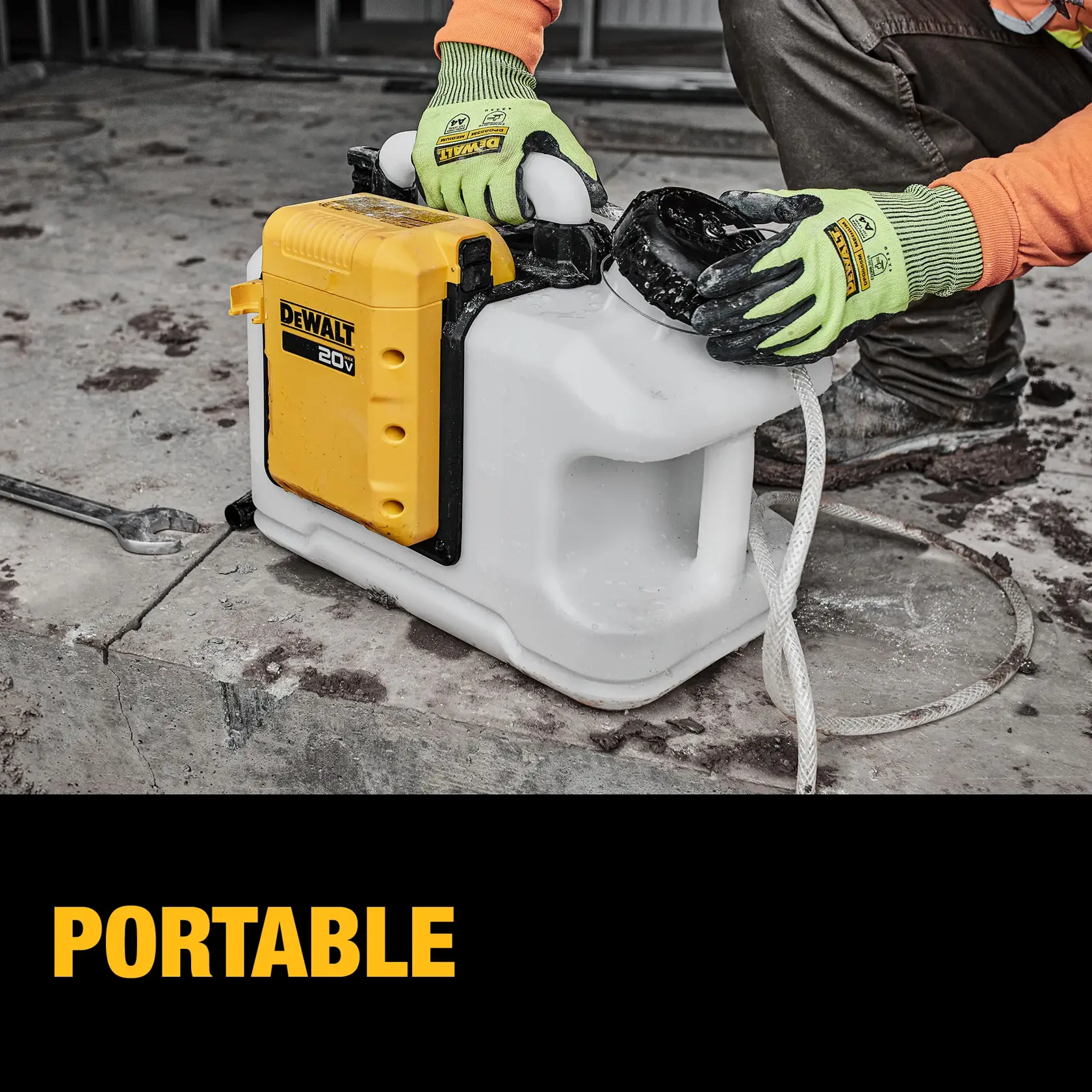 A person wearing gloves operates a DEWALT branded portable equipment with a yellow and white body, placed on a concrete surface. A large wrench and rope are nearby. The word 'PORTABLE' is displayed in yellow at the bottom.