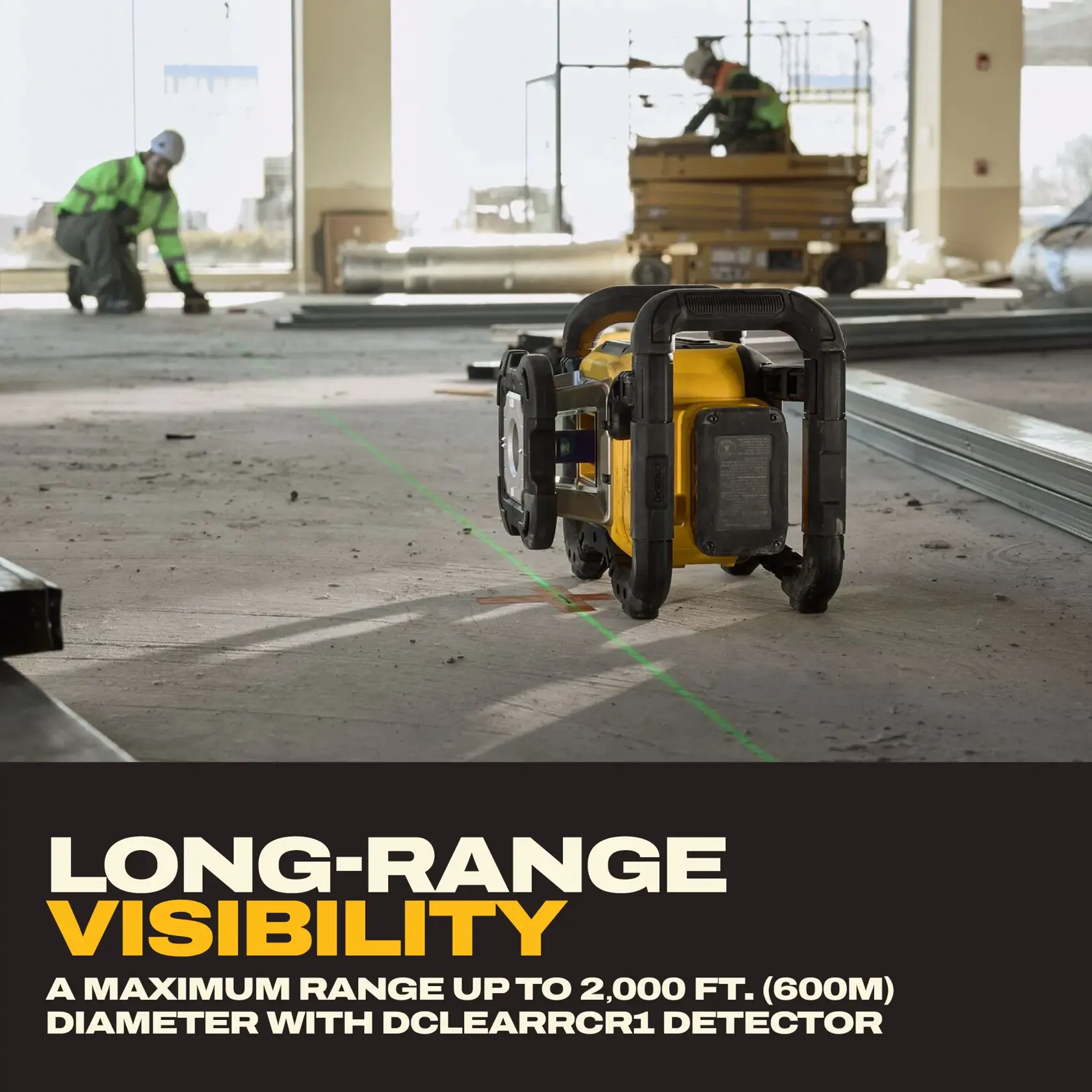 A DEWALT laser tool is set up in the middle of an indoor construction site, projecting a green laser line across the floor. Two construction workers are visible in the background, one kneeling and another operating machinery. The bottom of the image features text describing the tool's long-range visibility up to 2,000 feet (600 meters) with the DCLEARCR1 detector.