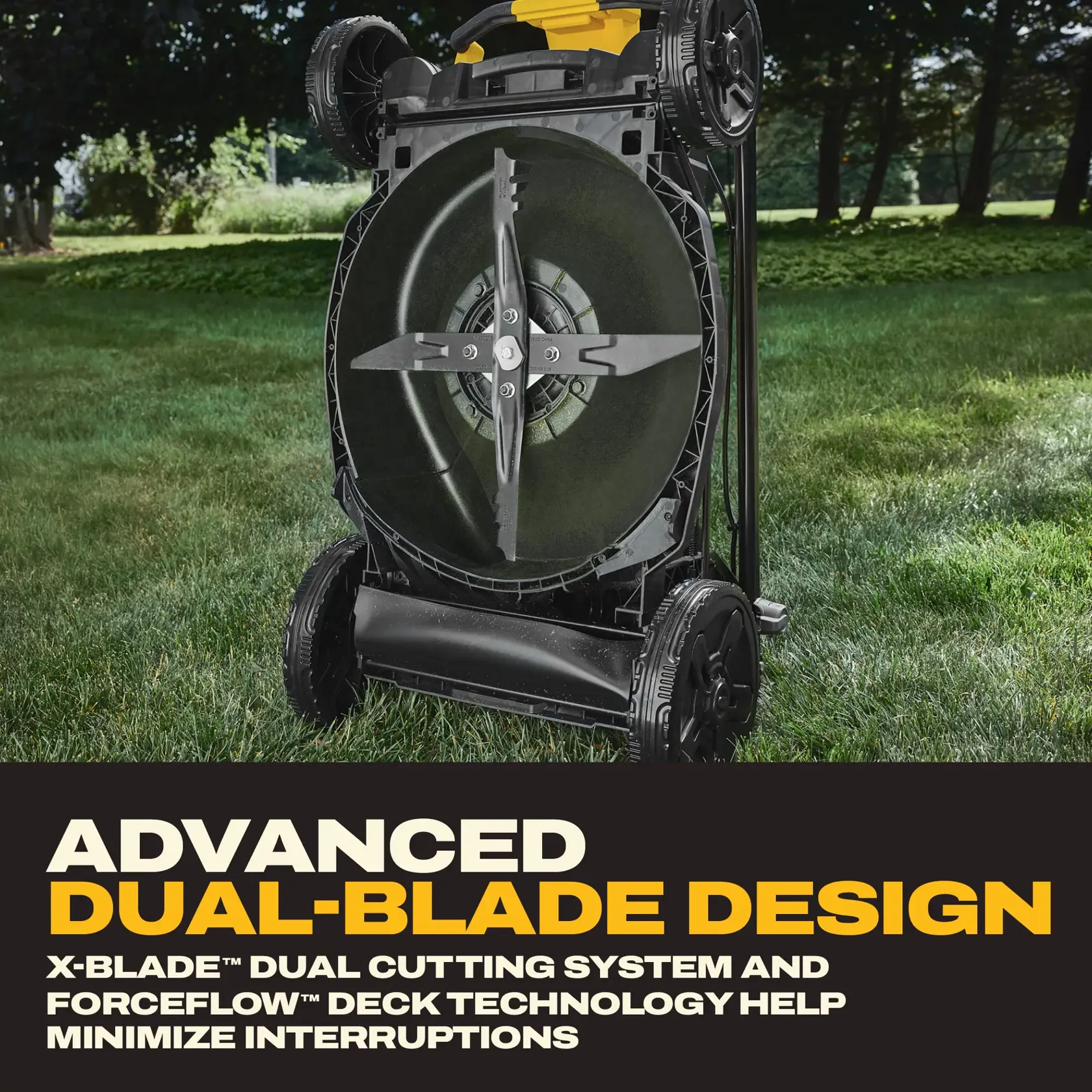 Lawn mower underside showing dual-blade design with text highlighting advanced cutting system and reduced interruptions.