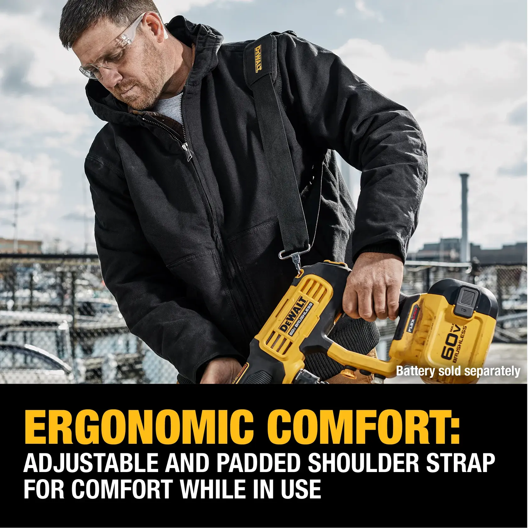 A person wearing a black jacket uses a DEWALT power tool with an adjustable and padded shoulder strap. The text highlights ergonomic comfort for the user. The battery for the tool is shown but noted as sold separately.