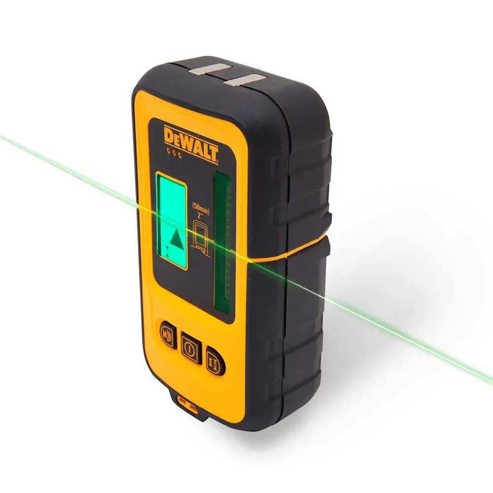 Green laser line detector being used by a person.