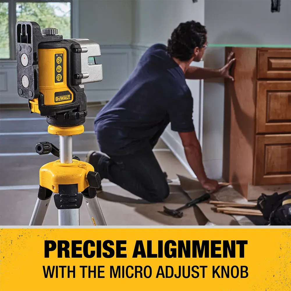 3 line green laser level being mounted on a tripod.