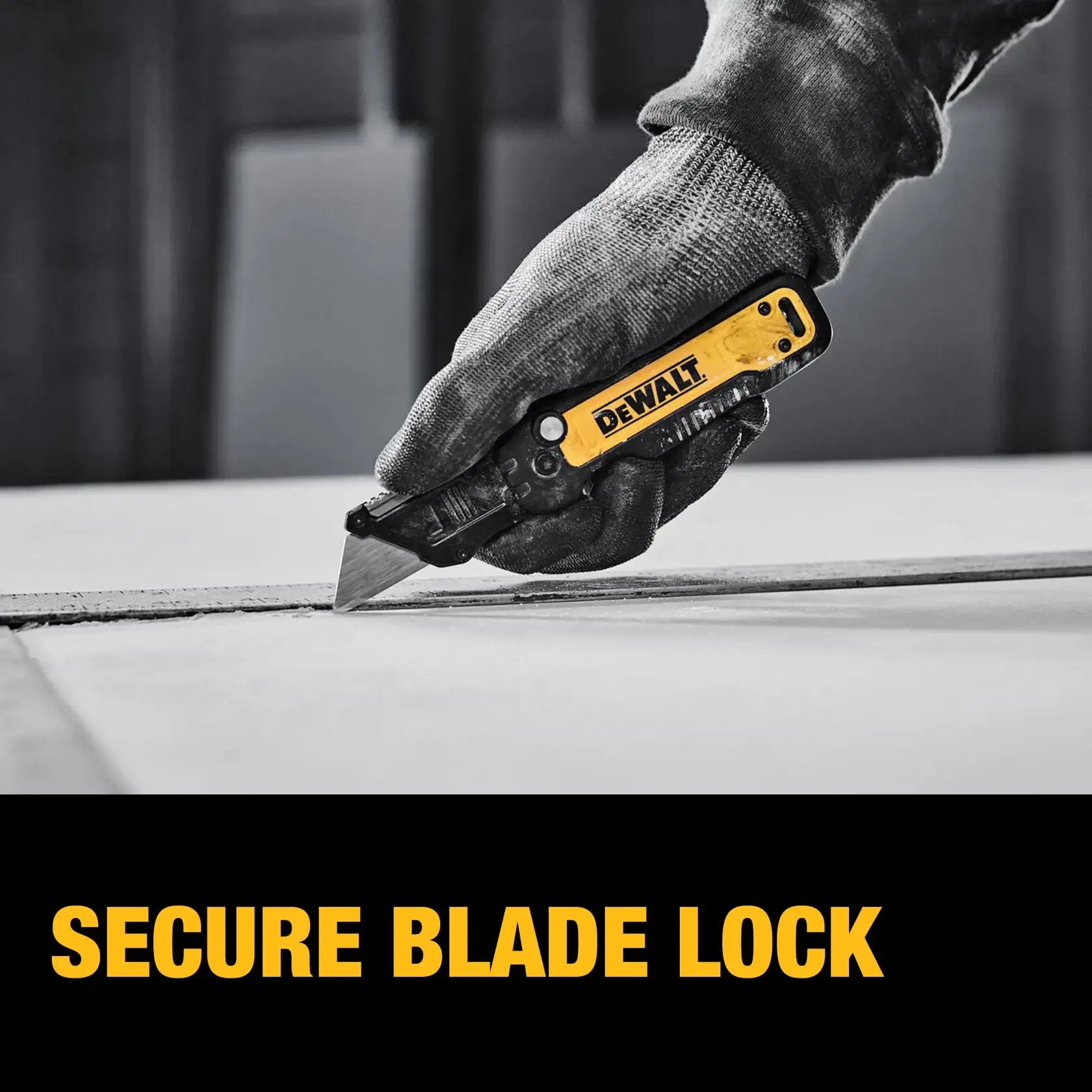 End user cutting sheet of drywall with DEWALT® DWHT10991 Utility Knife guided by a T-Square graphic