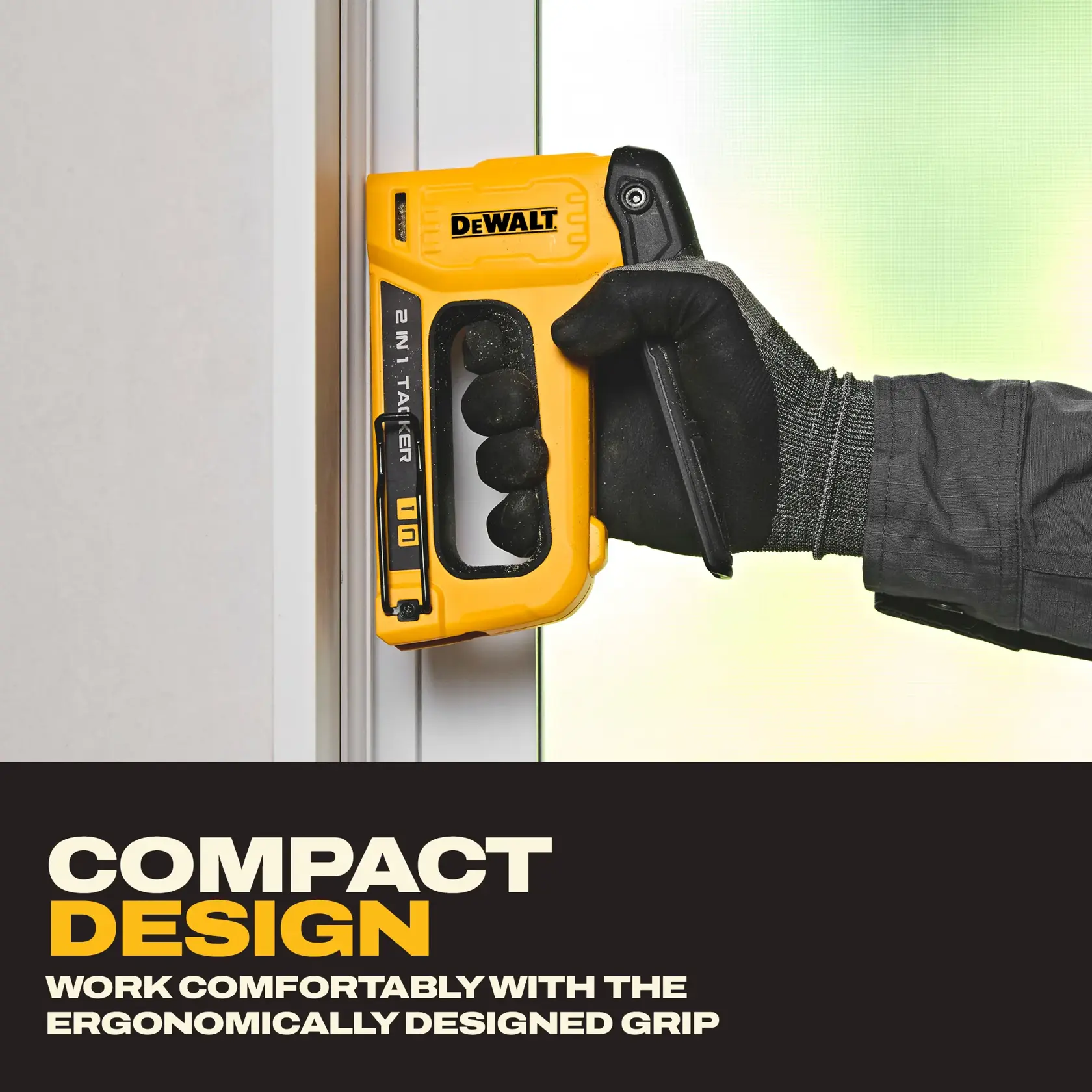 A person wearing a work glove holds a yellow DEWALT 2-in-1 stapler (model DWHT70350) against a vertical surface. The stapler features an ergonomic grip and the image text highlights its compact design for comfortable use.