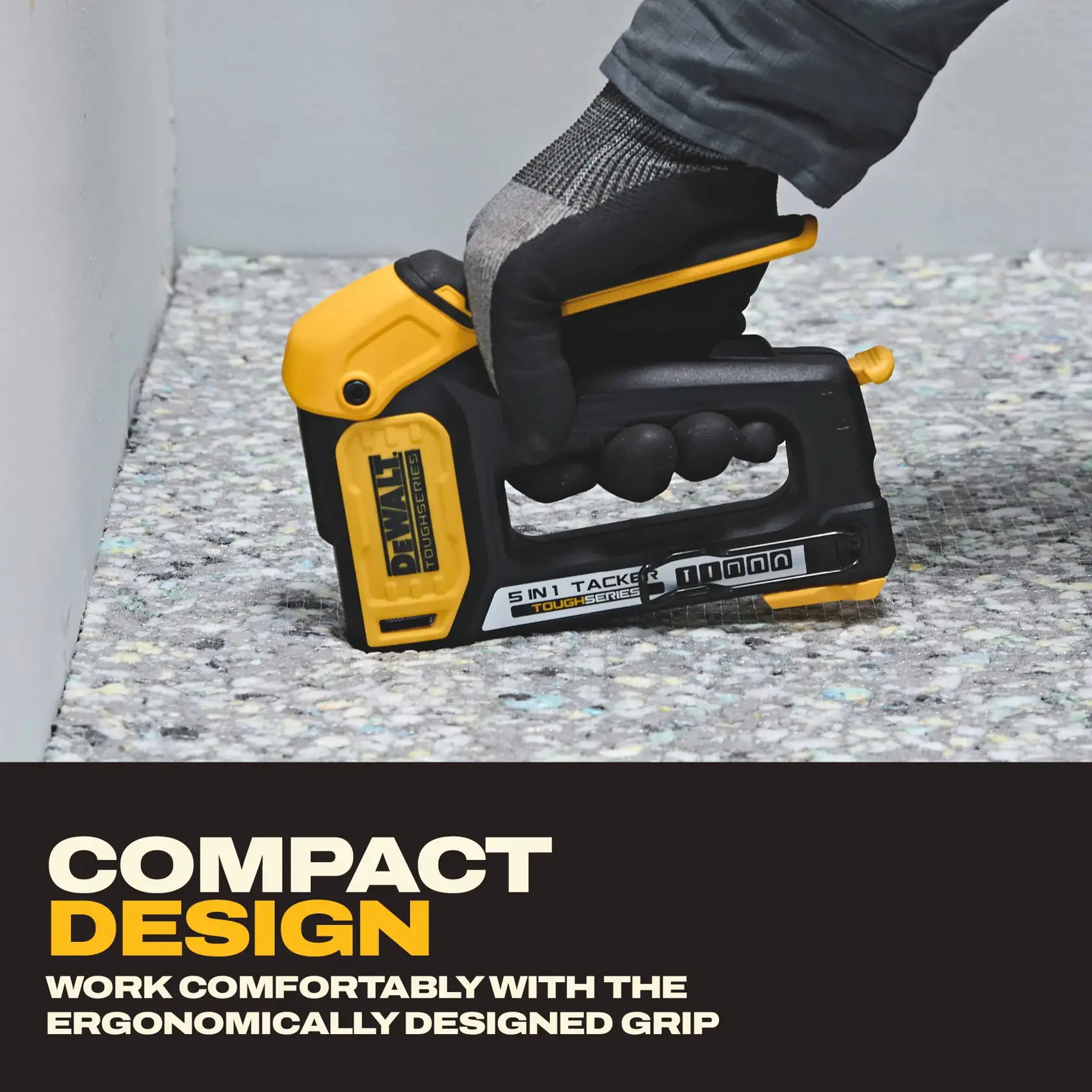 A person wearing a glove is using a DEWALT 5-in-1 tacker stapler with a yellow and black design on a surface near a wall. The image highlights the compact design and comfortable, ergonomic grip of the tool, with text stating 'COMPACT DESIGN' and 'WORK COMFORTABLY WITH THE ERGONOMICALLY DESIGNED GRIP.'