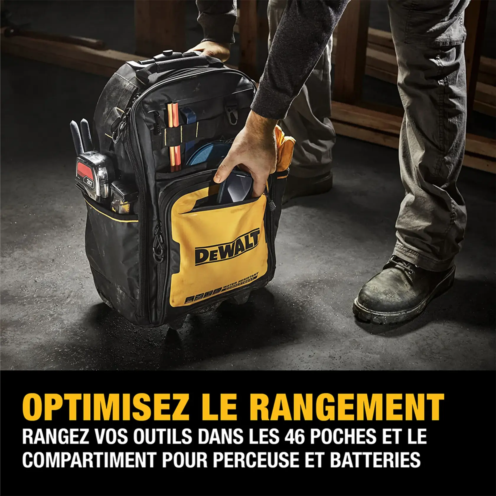 Image of person placing item in DeWalt Pro Backpack on wheels