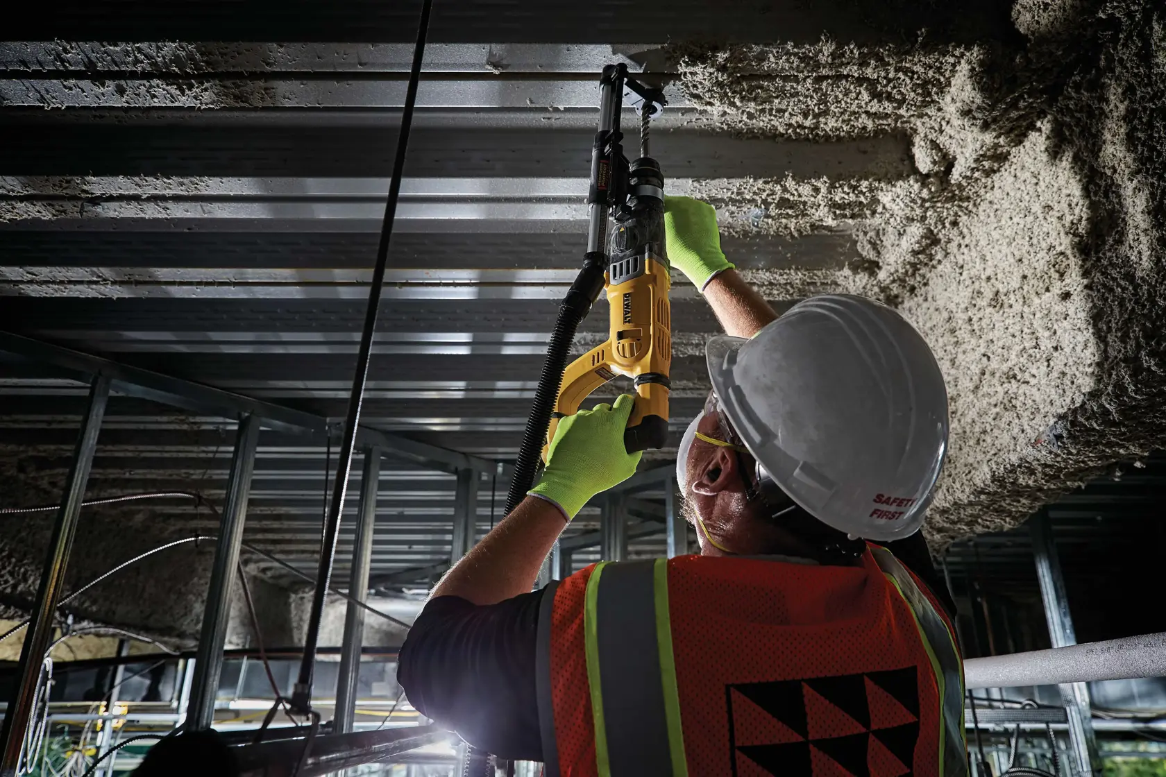 D-Handle SDS hammer being used by person to drill hole in  roof