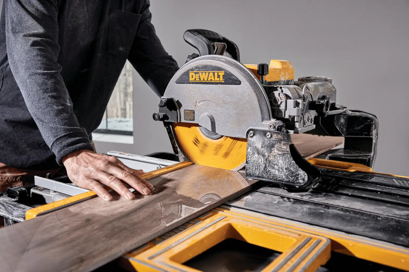 High Capacity Wet Tile Saw with Stand being used to cut a tile