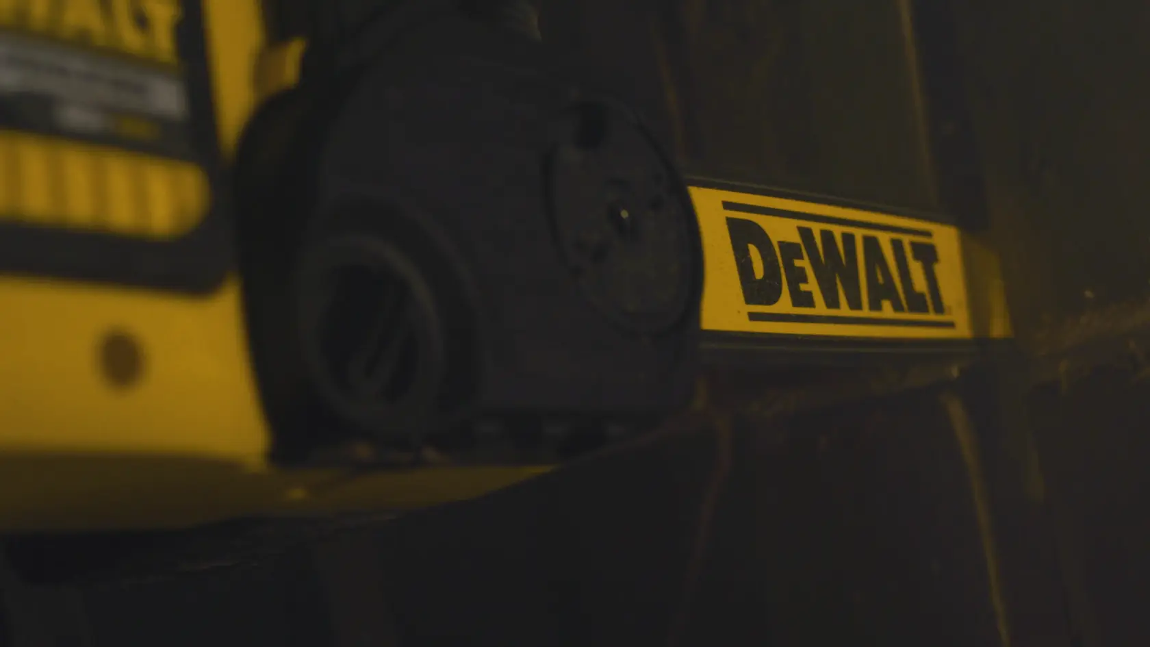 Application shot of DeWalt 60V MAX Brushless Chainsaw being held by firefighter