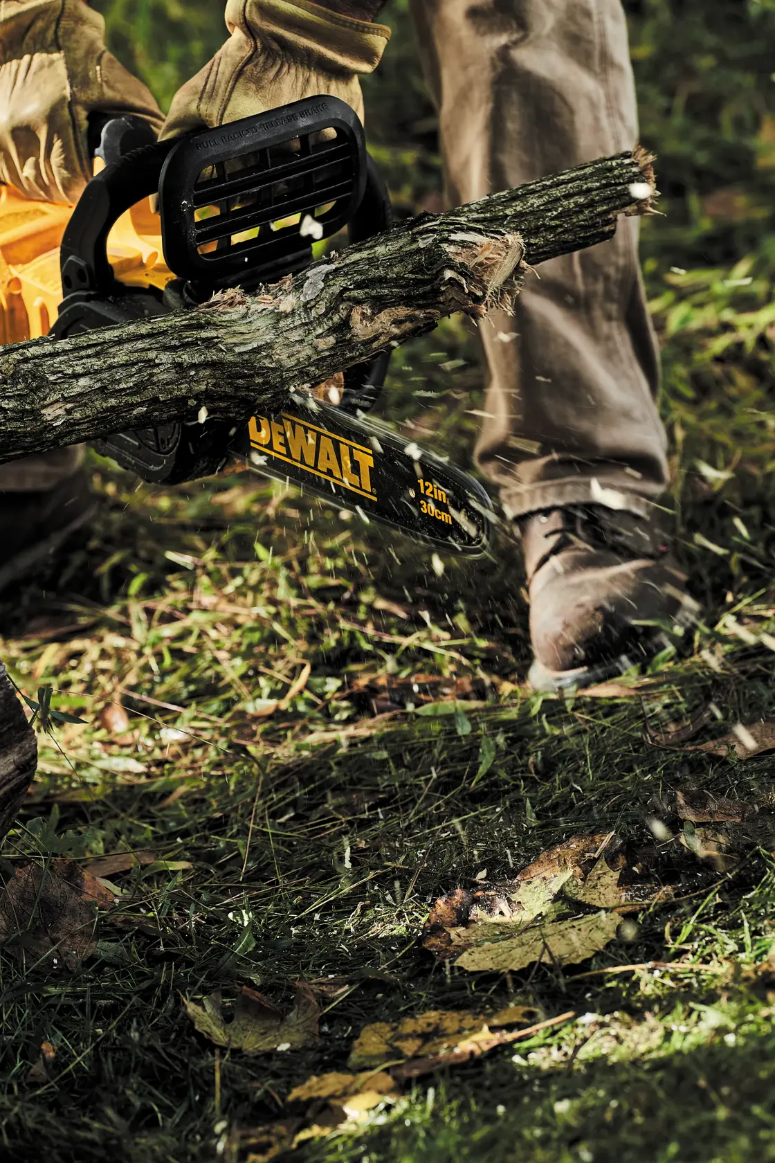 FLEXVOLT Cordless Chainsaw in use on a tree limb outdoors