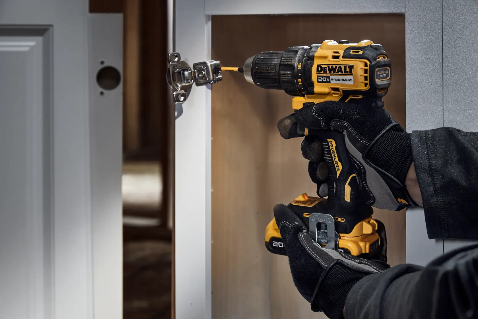 20V MAX Brushless Drill/Driver drilling into a cabinet