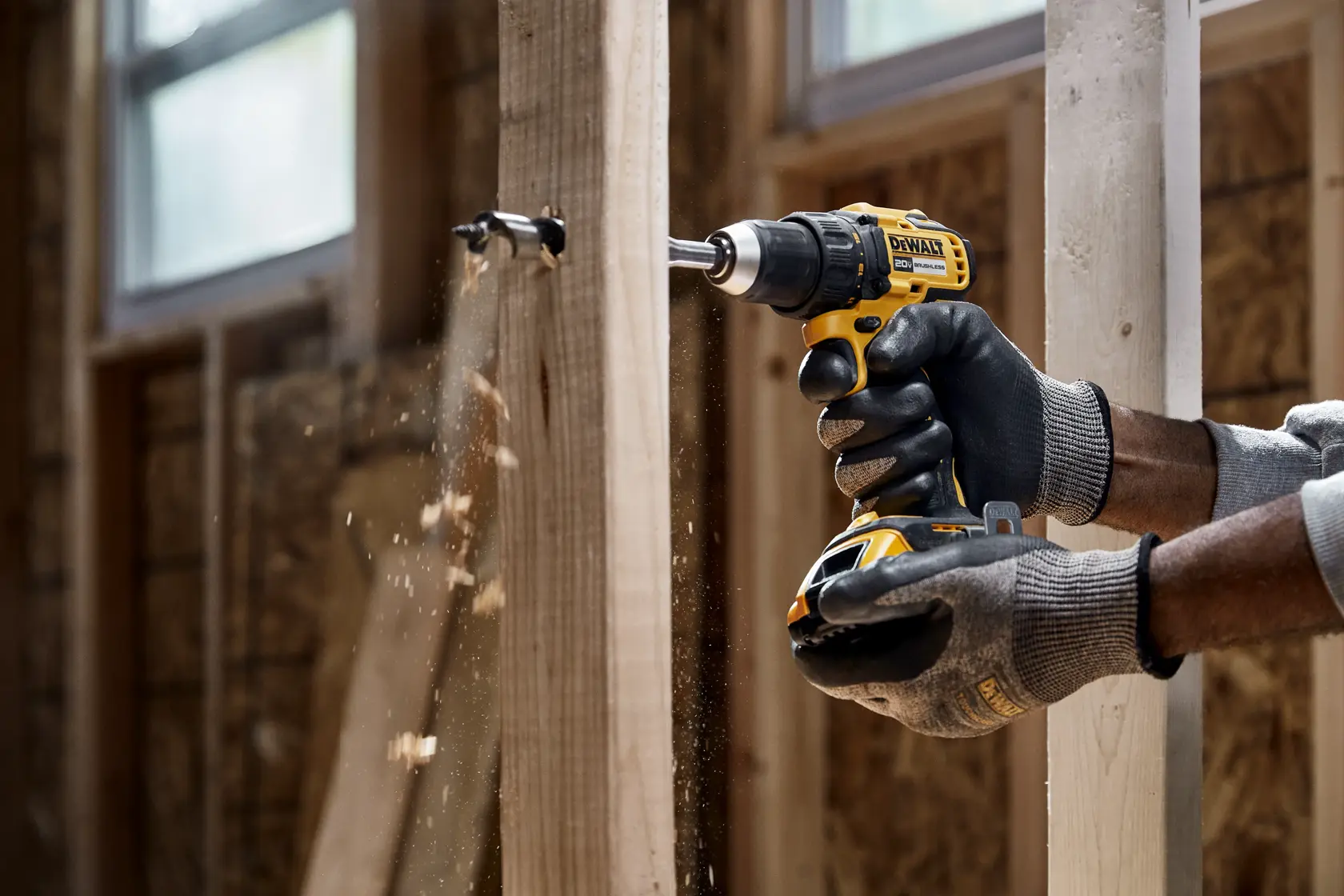 20V MAX Brushless Drill/Driver drilling into wood framing close up