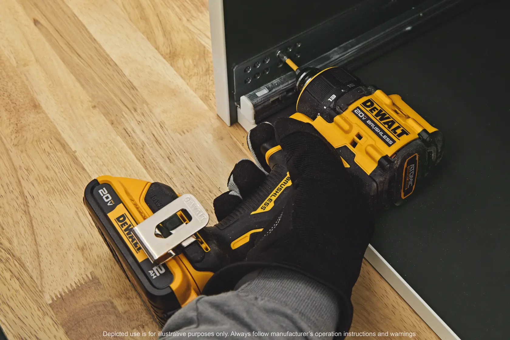 A person drilling using the ATOMIC™ 20V MAX* Multi-Head Drill/Driver with an attachment 