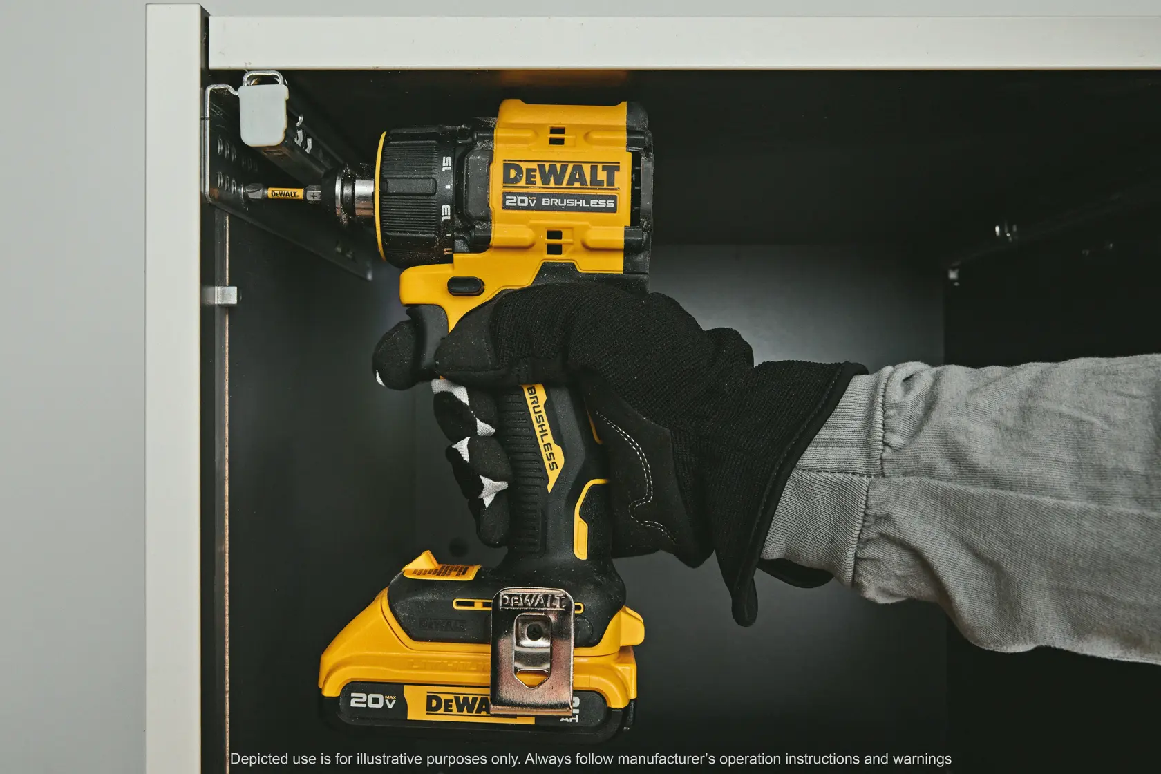 A person drilling using the ATOMIC™ 20V MAX* Multi-Head Drill/Driver with an attachment 