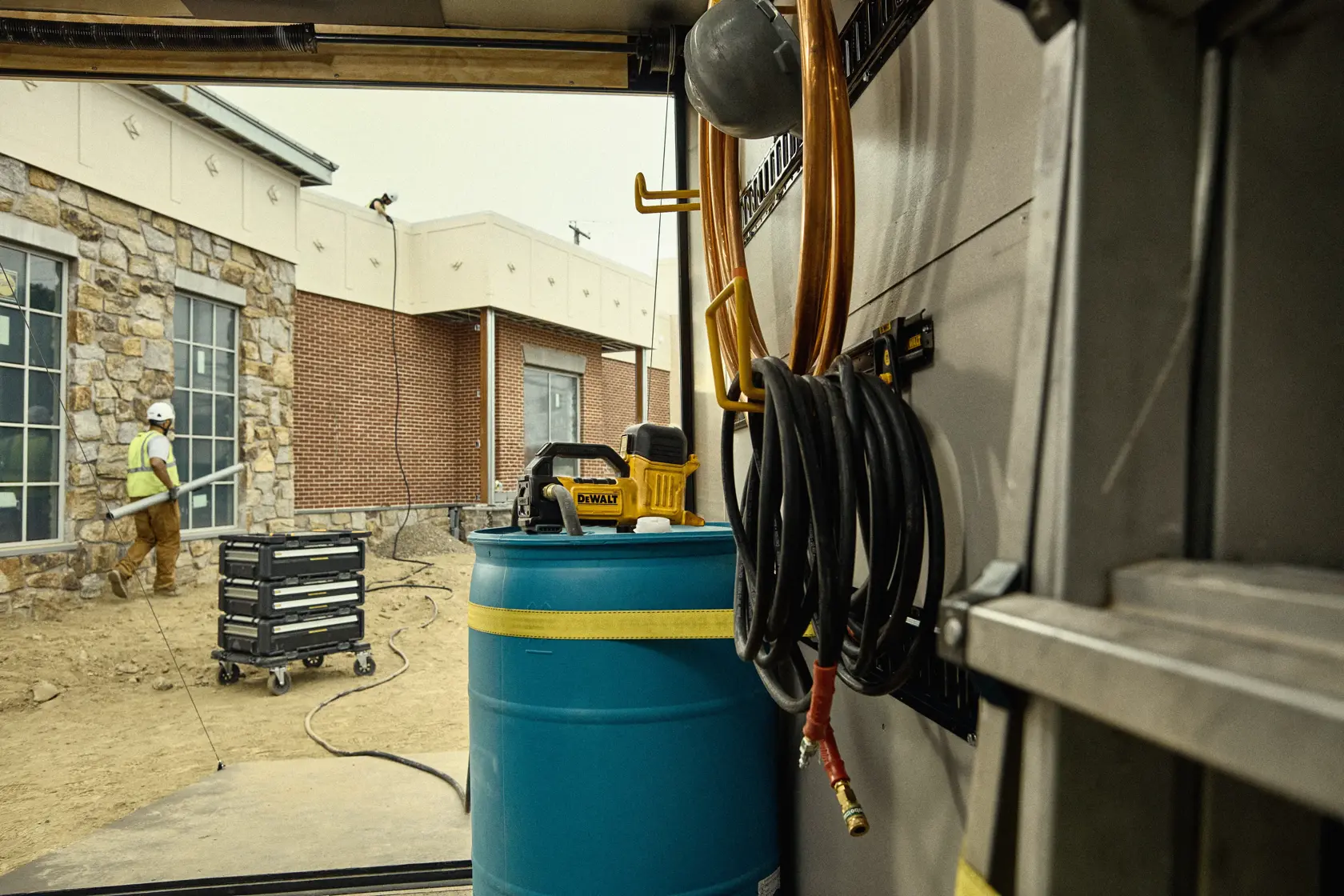 DEWALT Transfer Pump in the back of a truck on a job site. 
