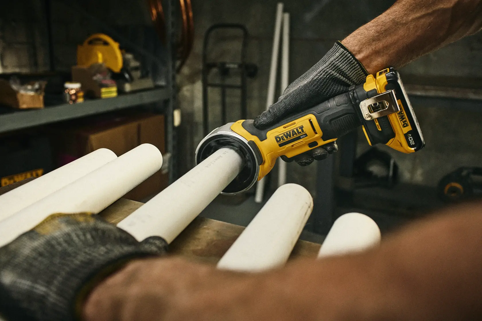 DEWALT Deburing Tool being used on plastic pipe at a work station. 