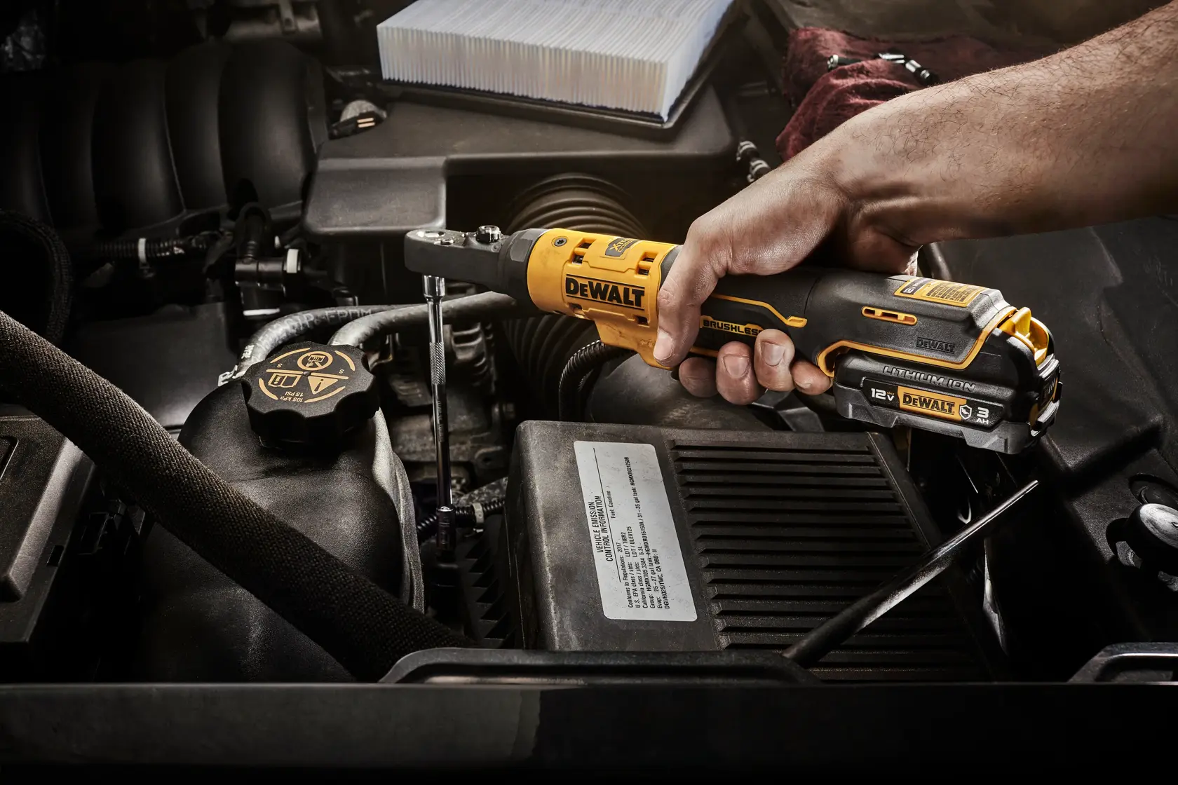 DCF500B XTREME 12V MAXSealed Head Ratchet application image of fastening a bolt in an engine 