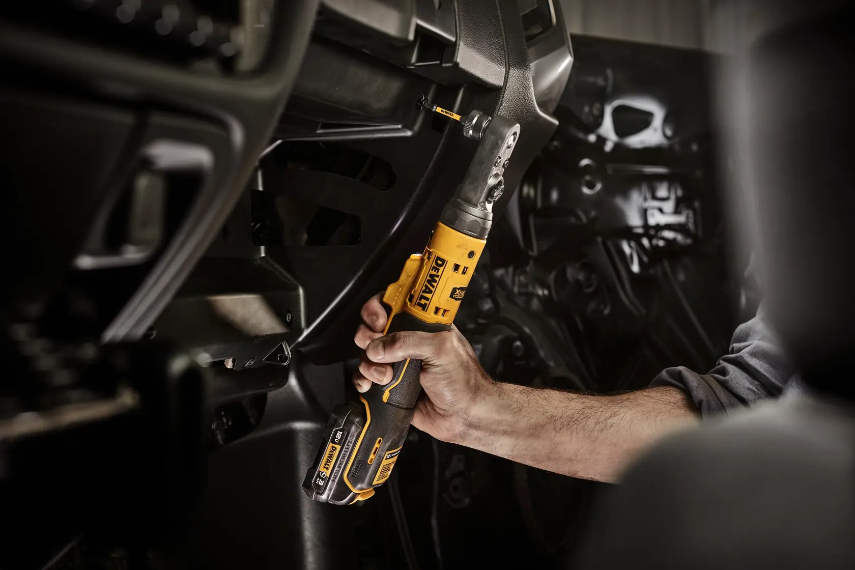 DCF500GG1 XTREME 12V MAX Sealed Head Ratchet application image fastening with 1/4 inch quick change bit 