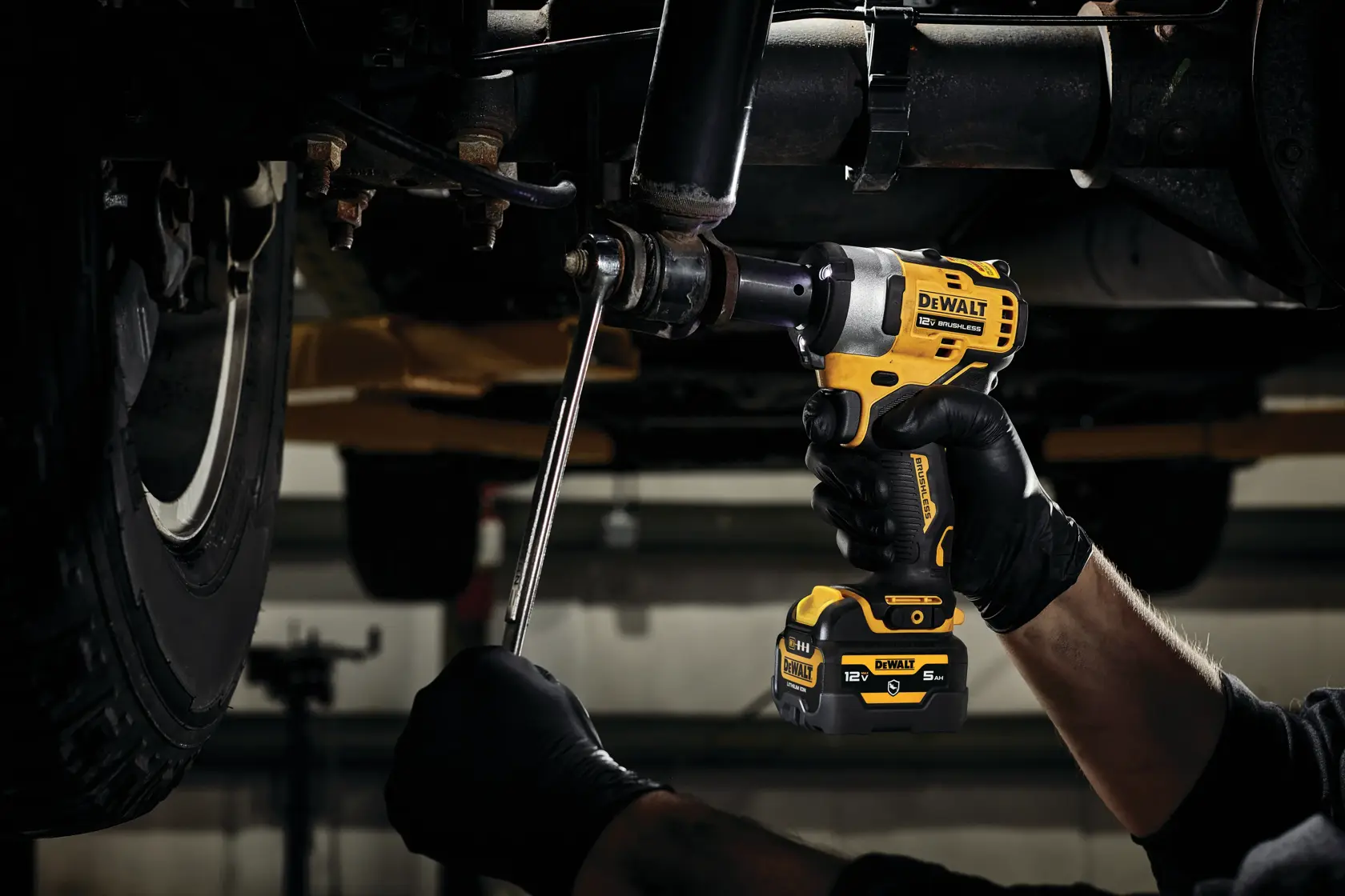 CORDLESS IMPACT WRENCH being used on a car engine