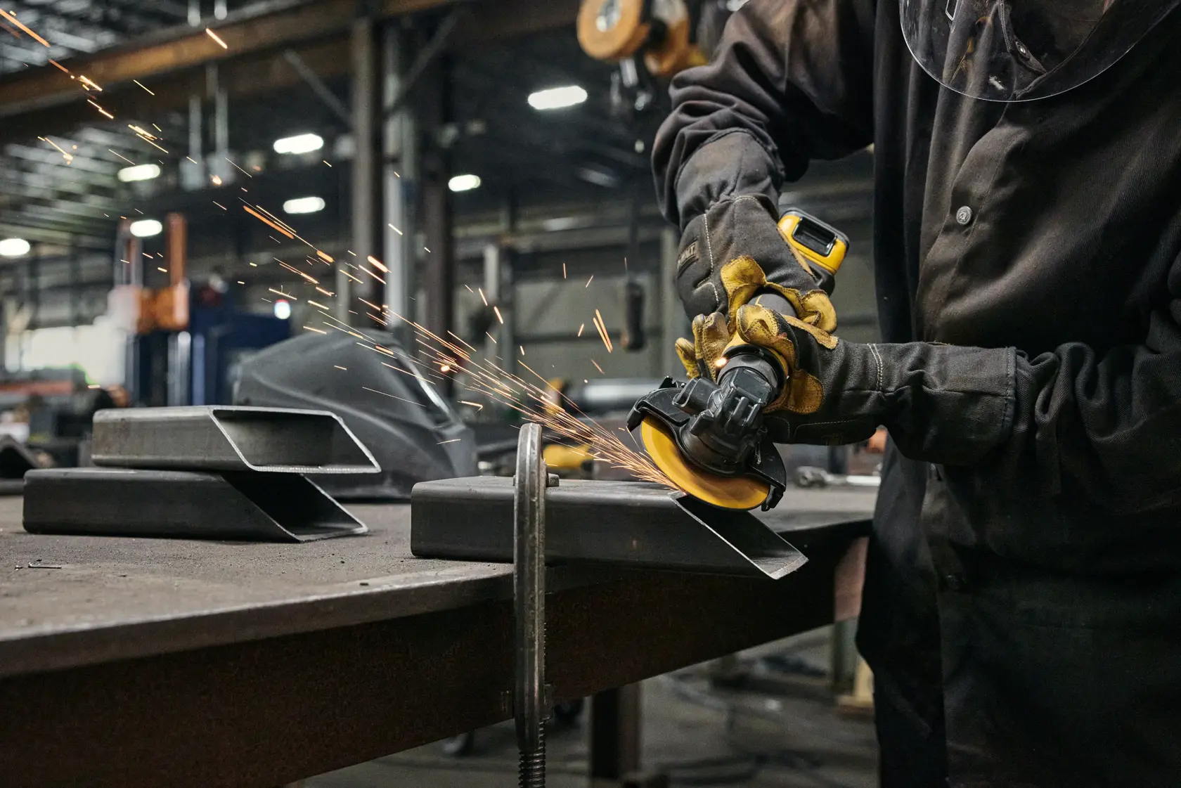 User grinding with ATOMIC™ 20V MAX* 4 in. Angle Grinder