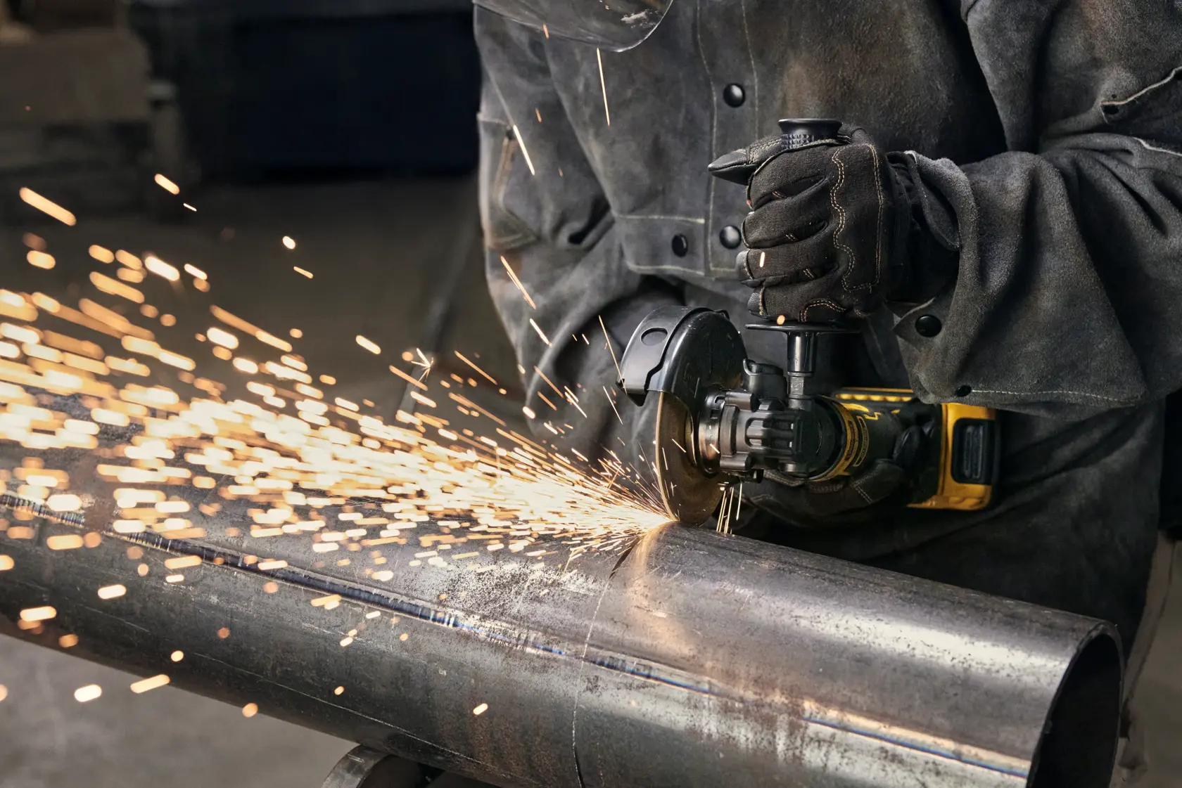 User cutting with ATOMIC™ 20V MAX* 4.5 in. Angle Grinder