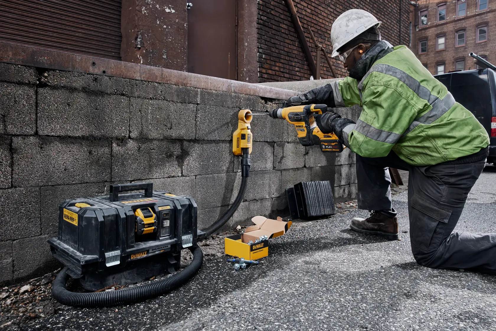 60 volt 1 and quarter inch brushless cordless S D S plus rotary hammer tool being used by a person.