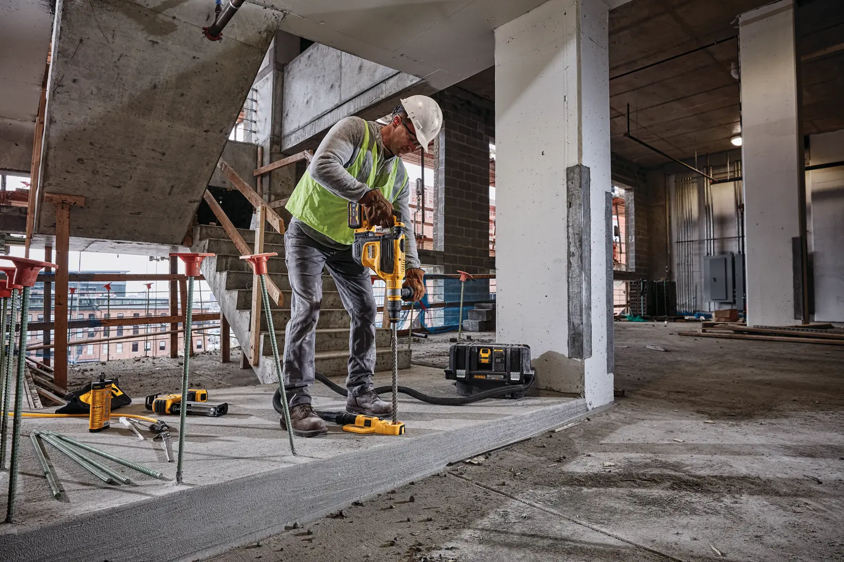 Brushless, cordless SDS MAX combination rotary hammer being used by a person