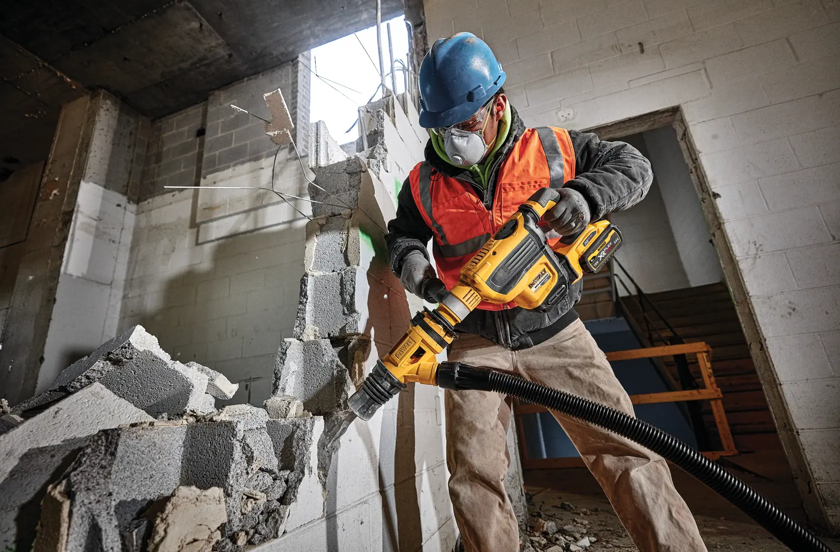 Brushless, cordless SDS MAX combination rotary hammer being used by a person