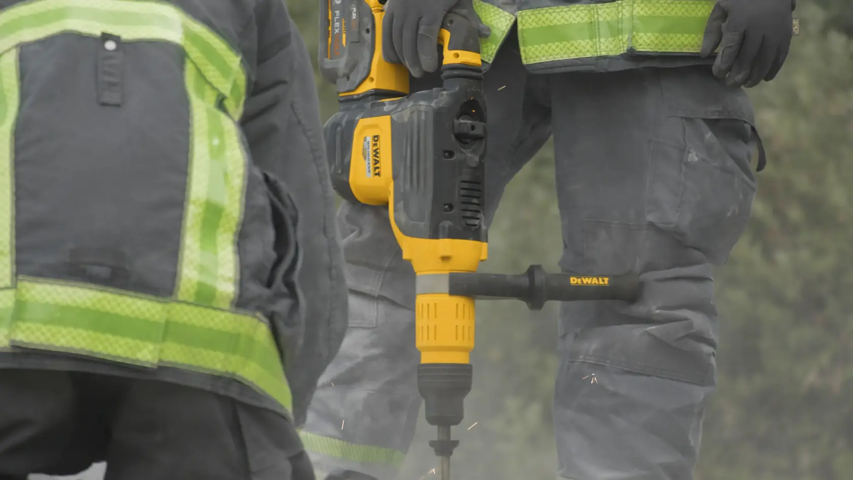 Image of Fire Fighter holding DeWalt 2 In Brushless Cordless Combination Rotary Hammer