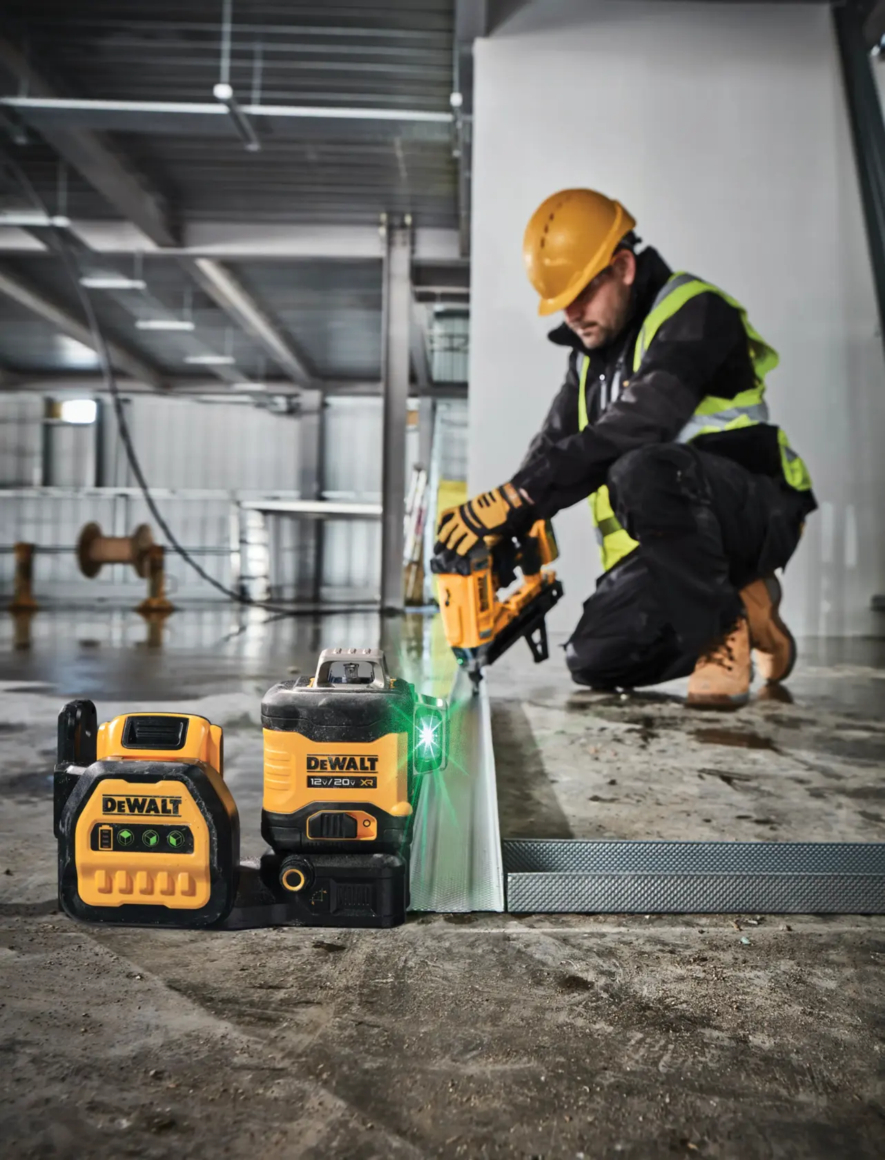 green line laser being used by a worker