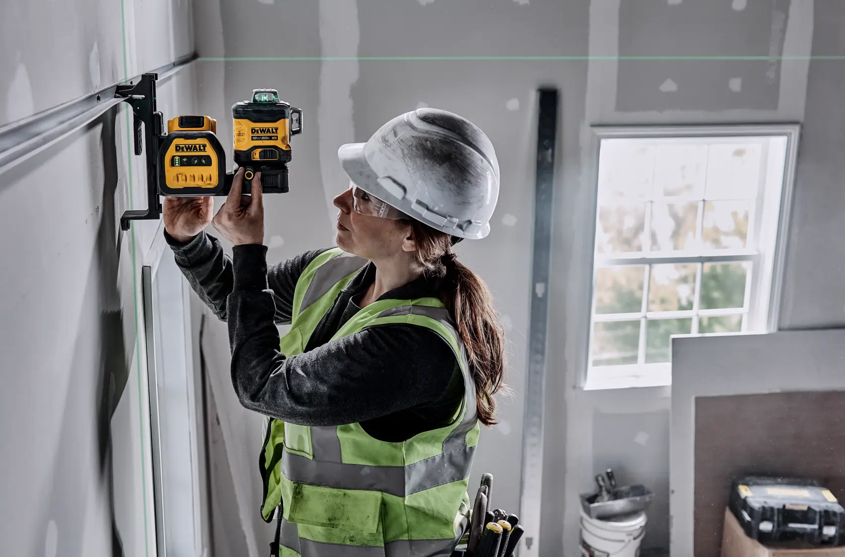 green laser being set up by a person