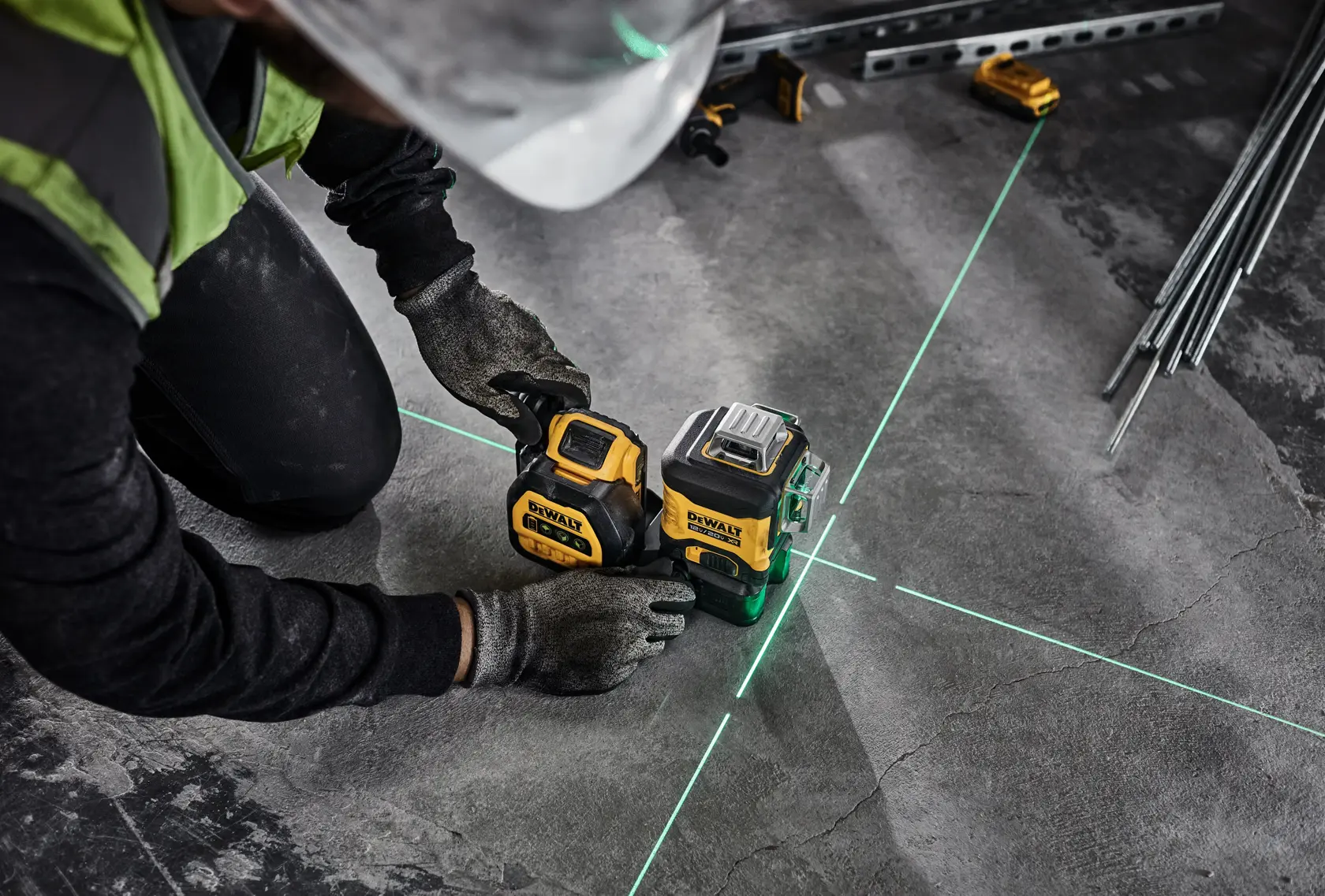 DEWALT Laser is used by a tradesman to line up where he will drill overhead.