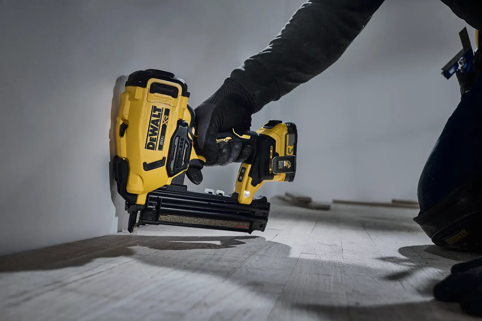 Nailer being used to nail flooring 