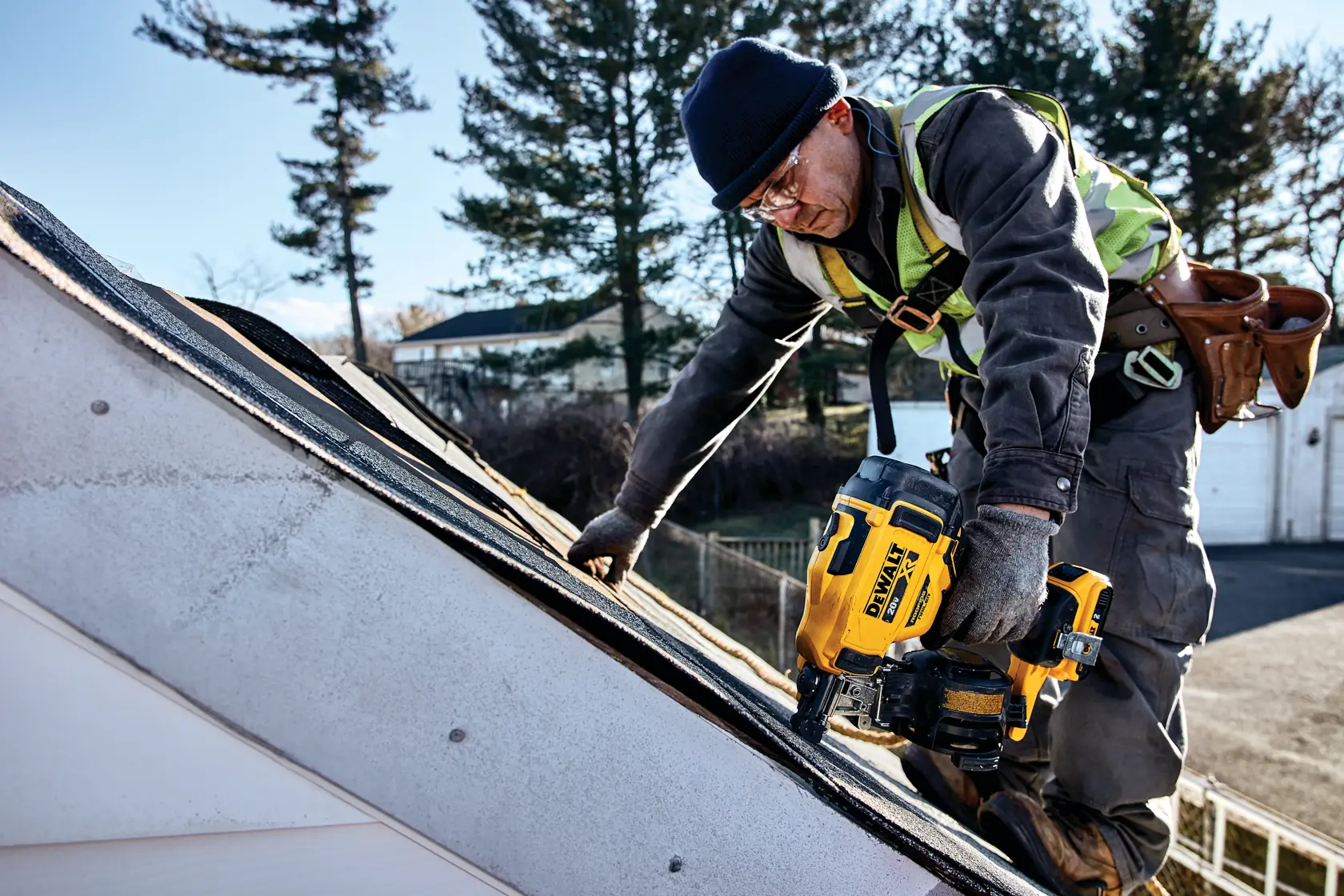 Cordless Coil Roofing Nailer being used by a construction worker on a roof