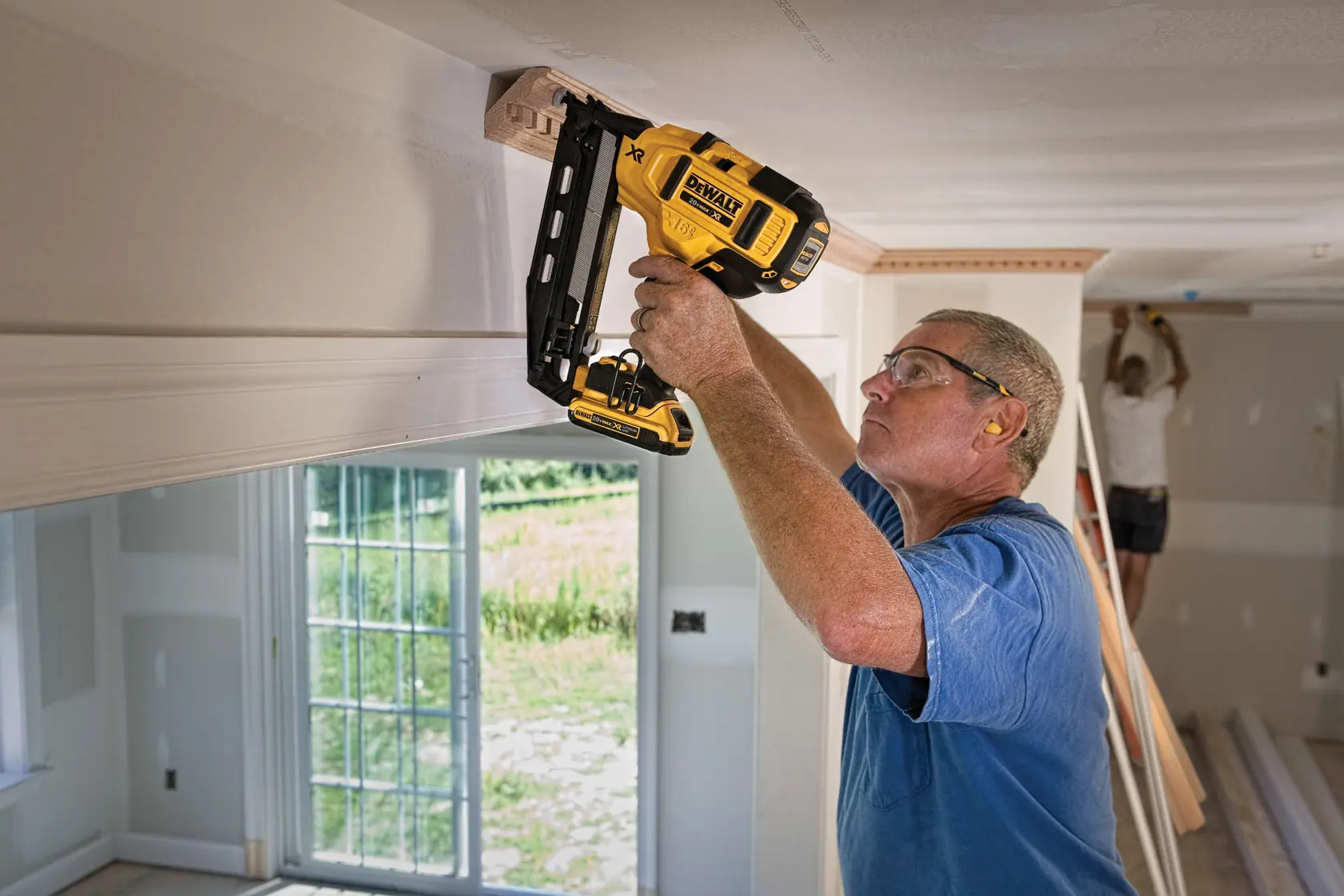 XR 16 Gauge Angled Finish Nailer being used to fix a decorative ceiling panel by a construction worker