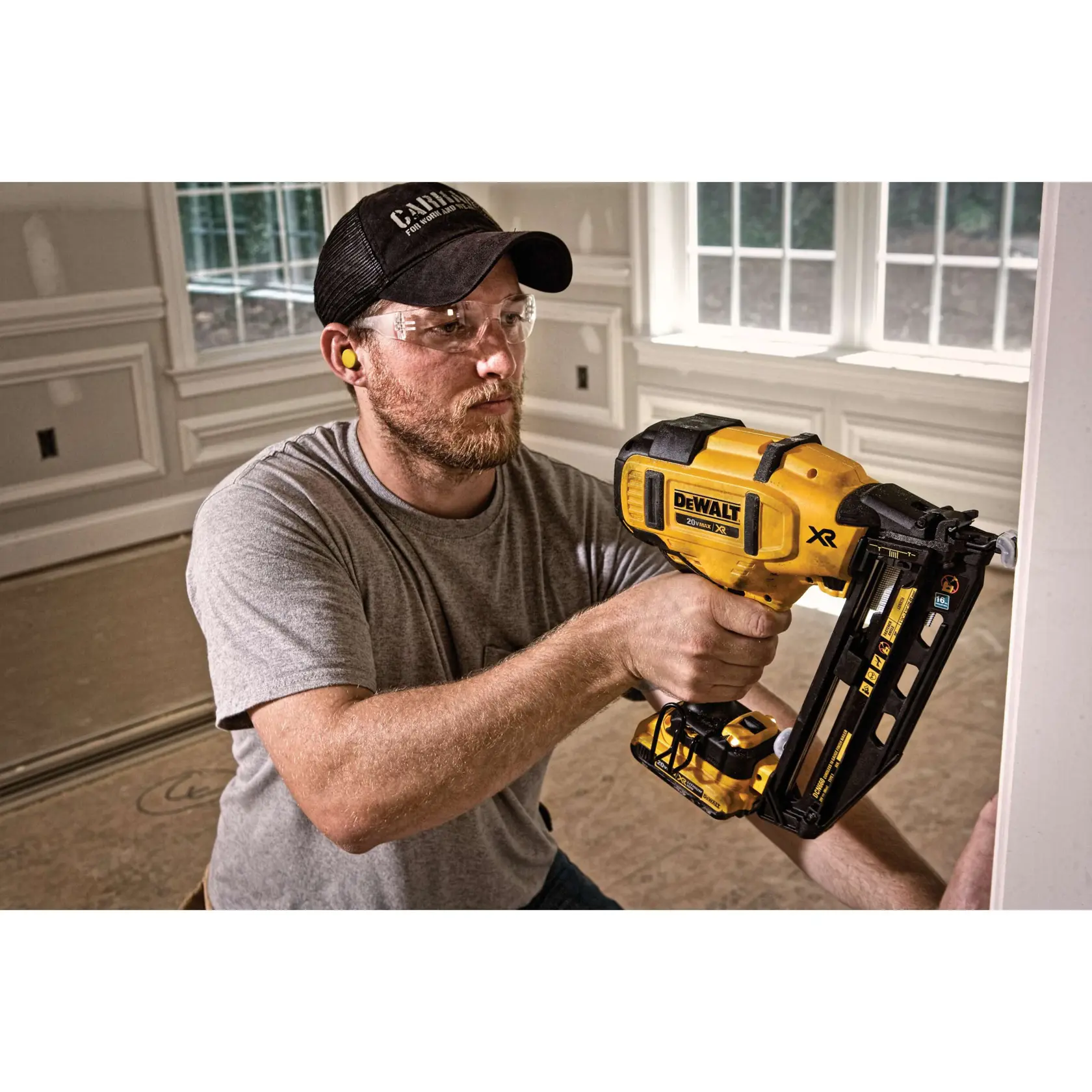 XR 16 Gauge Angled Finish Nailer in action by a construction worker on a wall at a construction in progress house