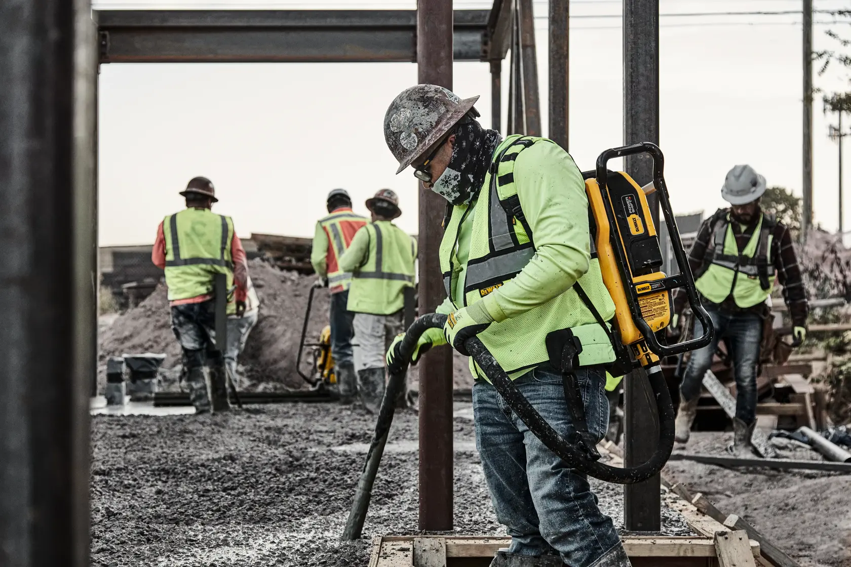 Man operating backpack vibrator