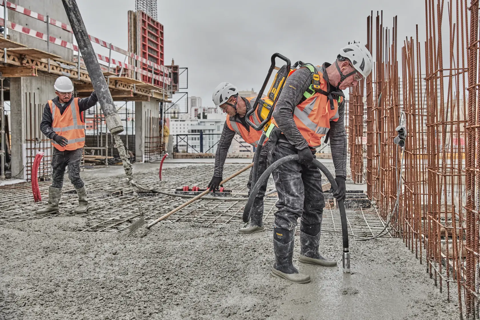 Man operating backpack vibrator