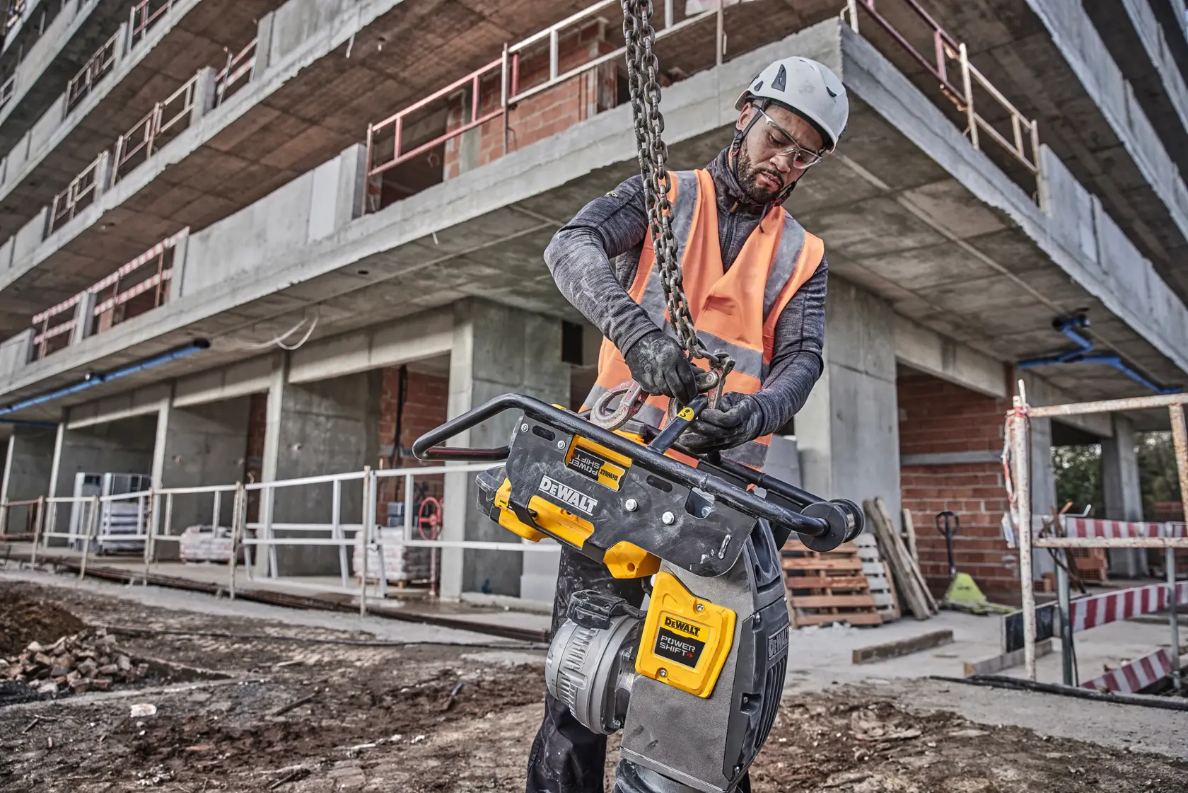 Man putting chain on rammer