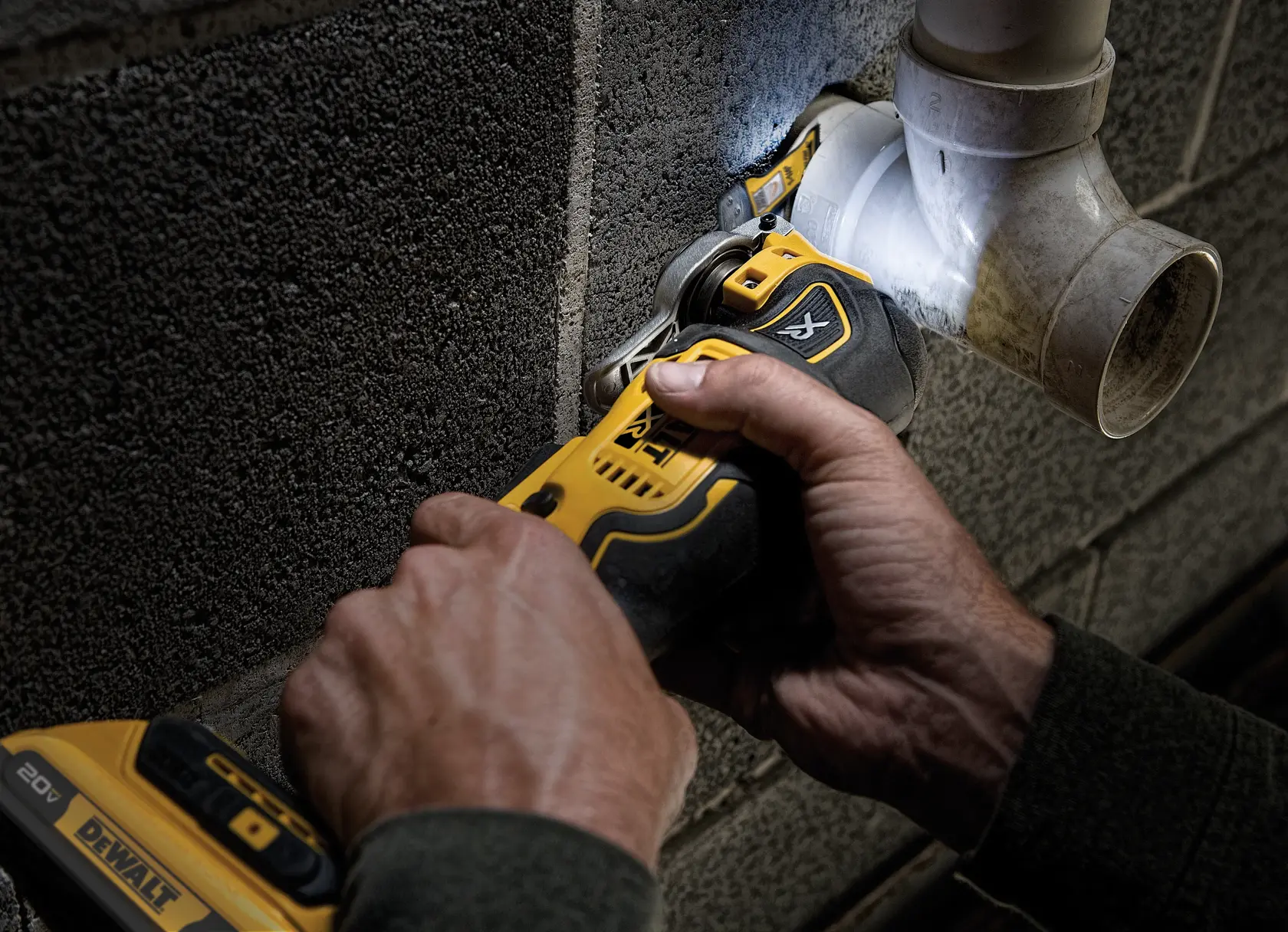 XR Cordless Oscillating Multi Tool being used to cut hardened bolt from toilet base