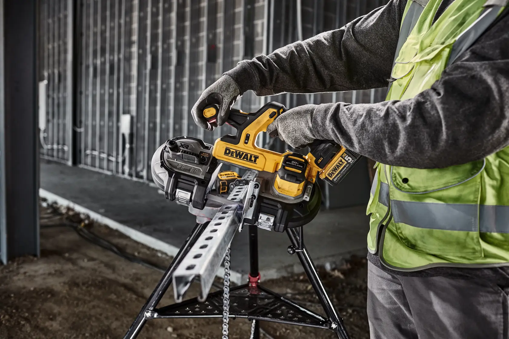 DEWALT Dual Trigger Bandsaw is used to cute strut from a pipe stand in a data center.