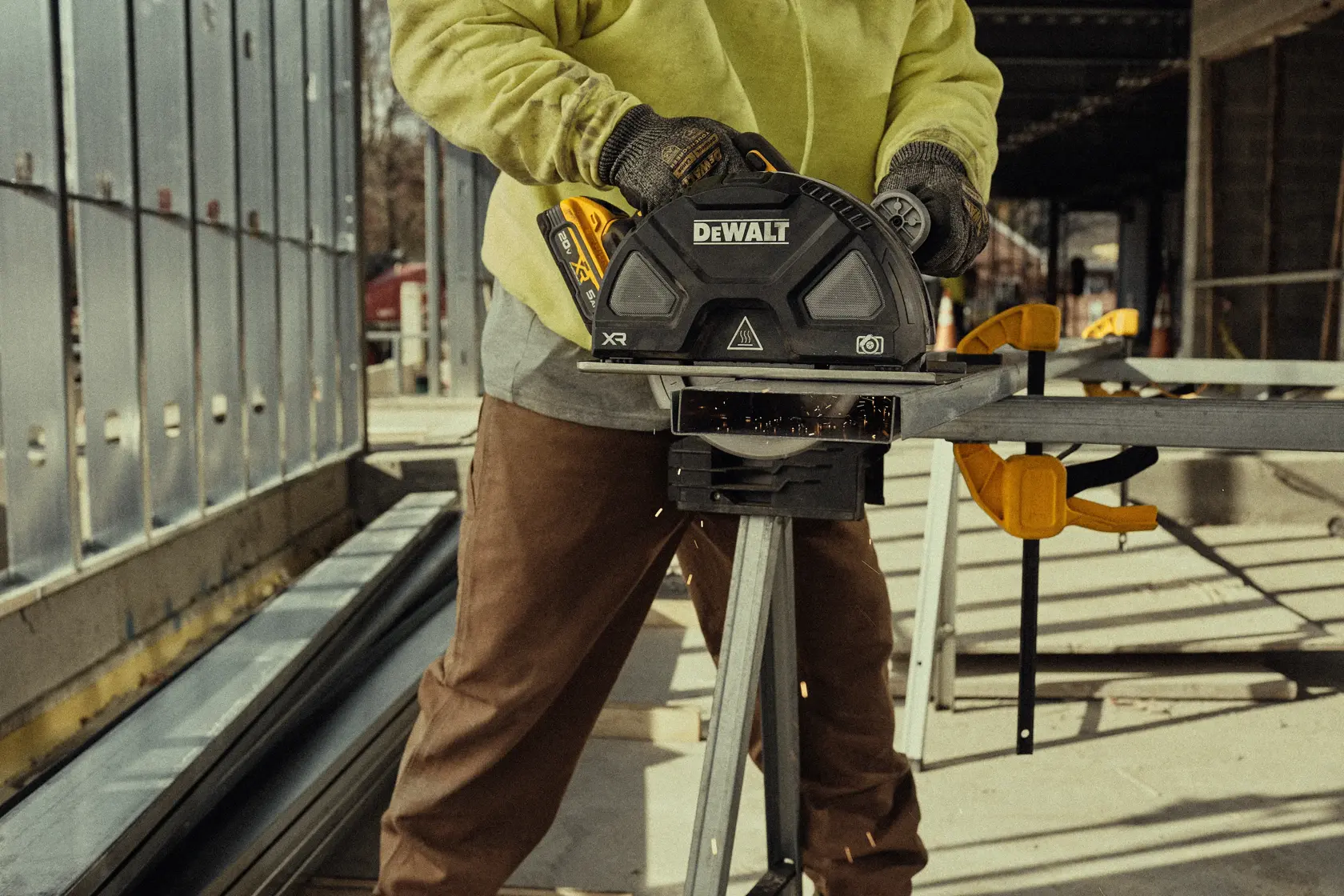 Man cutting with metal circular saw