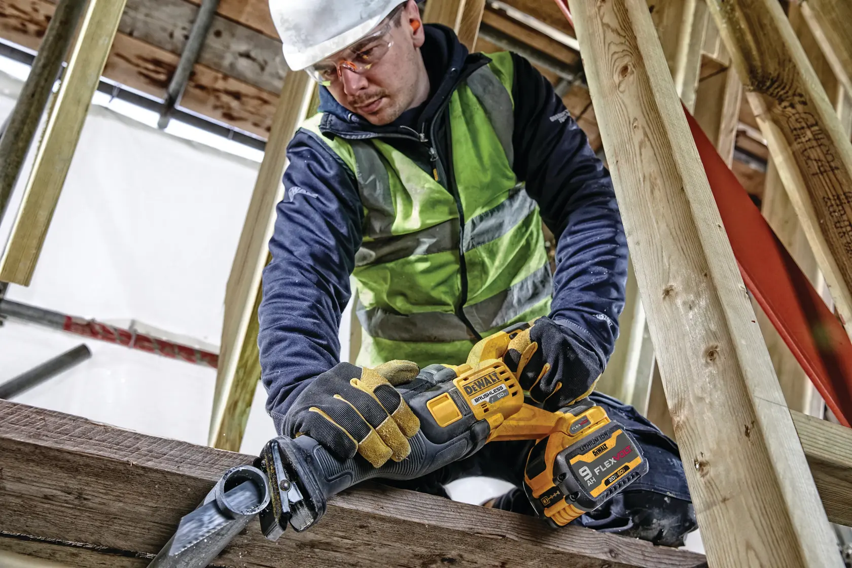 Application shot of DeWalt 60V Max Cordless Brushless Reciprocating Saw being used saw into car