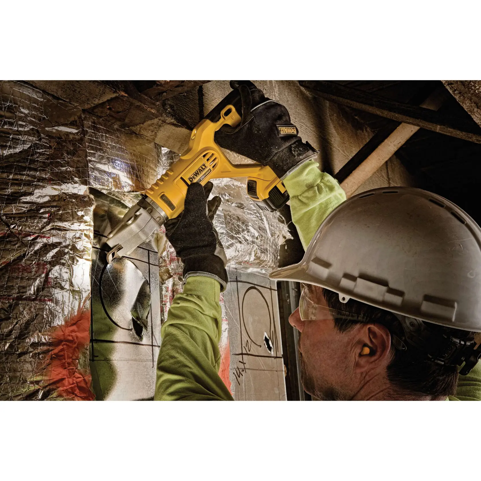 Swivel head shear being used to cut circular hole in metal sheet.