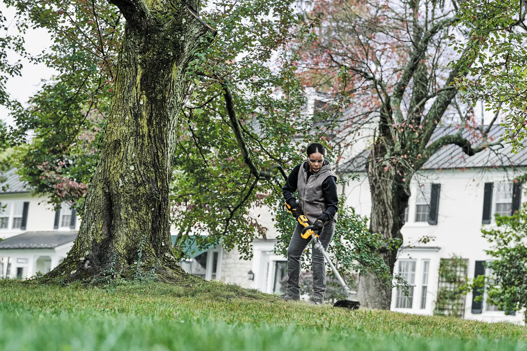 Folding String Trimmer being used by a person.