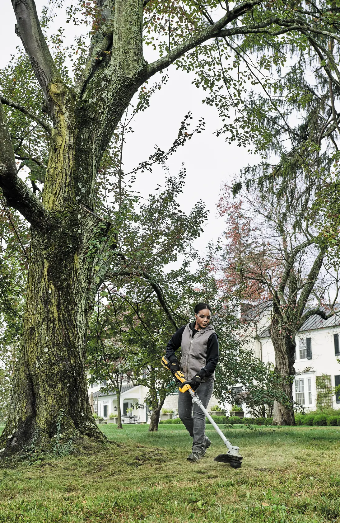 Folding String Trimmer being used by a person.