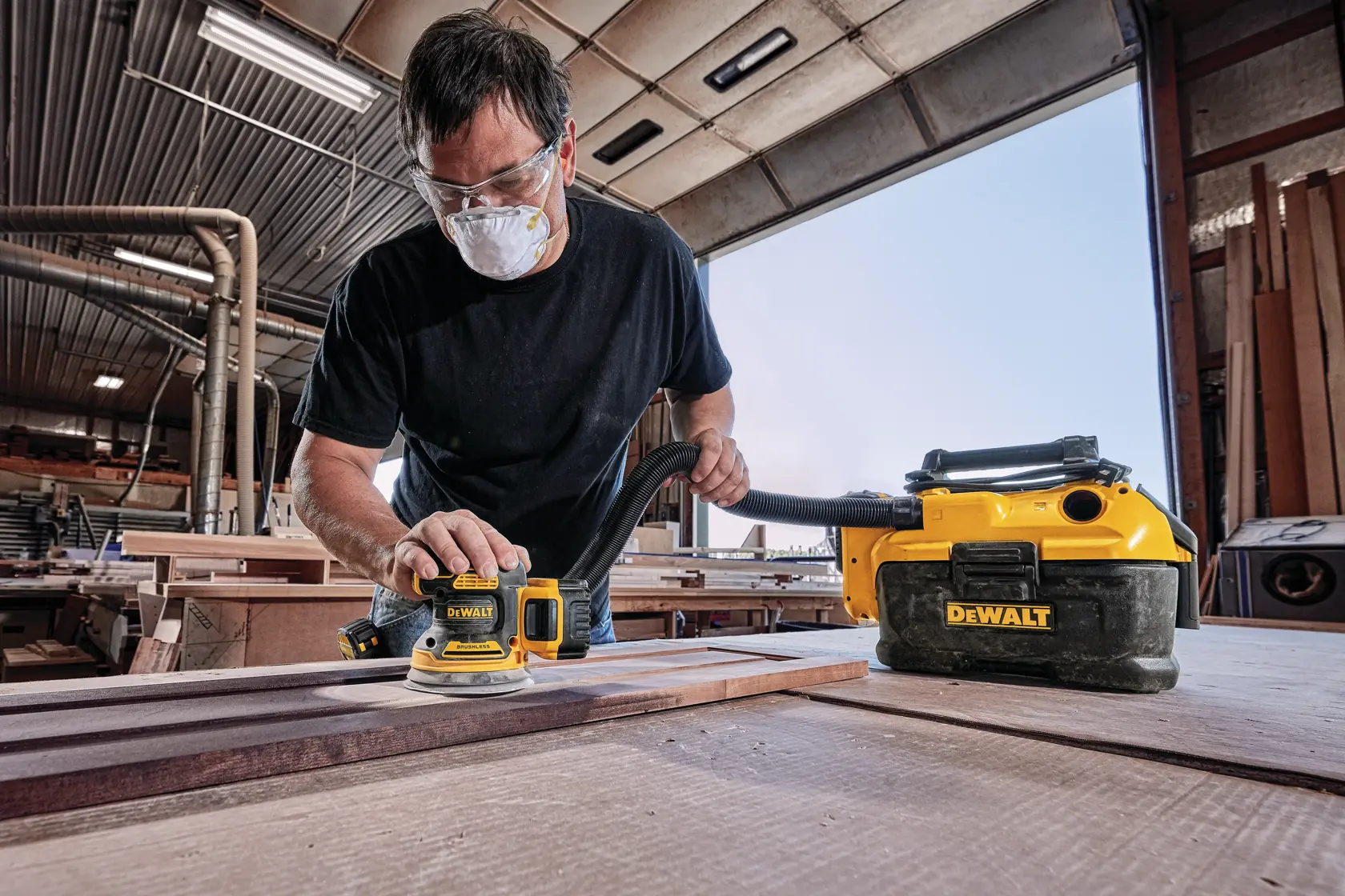 Brushless Cordless Variable Sheet Sander being used by a person.